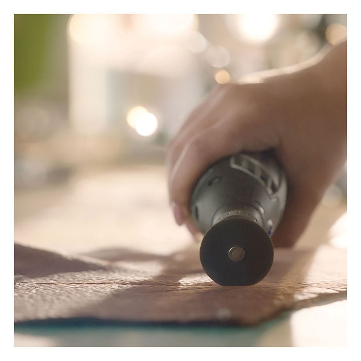 Dremel Lite Cordless Rotary Tool - Closeup of Tool scoring leather
