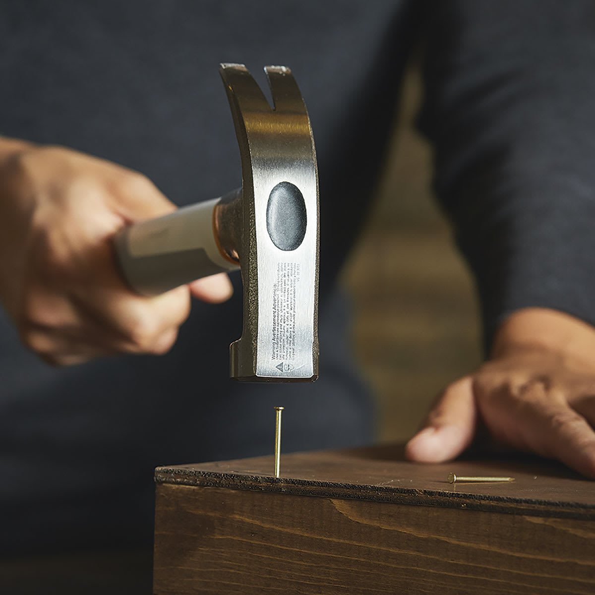 Fiskars Precision Hammer - Closeup of person using hammer to pound nail
