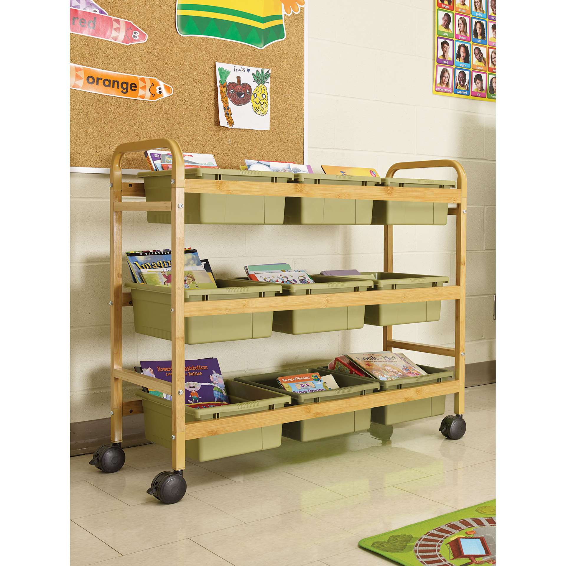 Copernicus Bamboo Book Browser Cart - Sage Green, 9 Bins, infront of a wall