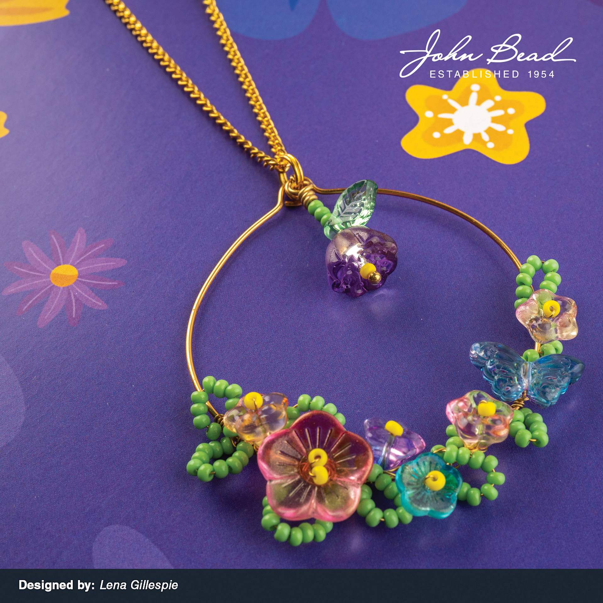 A variety of John Bead Crystal Lane DIY Glass Garden Beads used to create a necklace pendant.