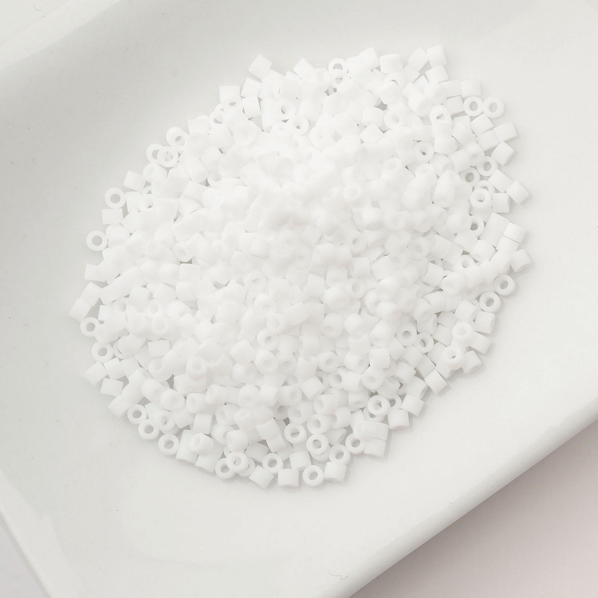 John Bead Cylin 11/0 Matte Macaron Cylindrical Seed Beads - White sitting in dish
