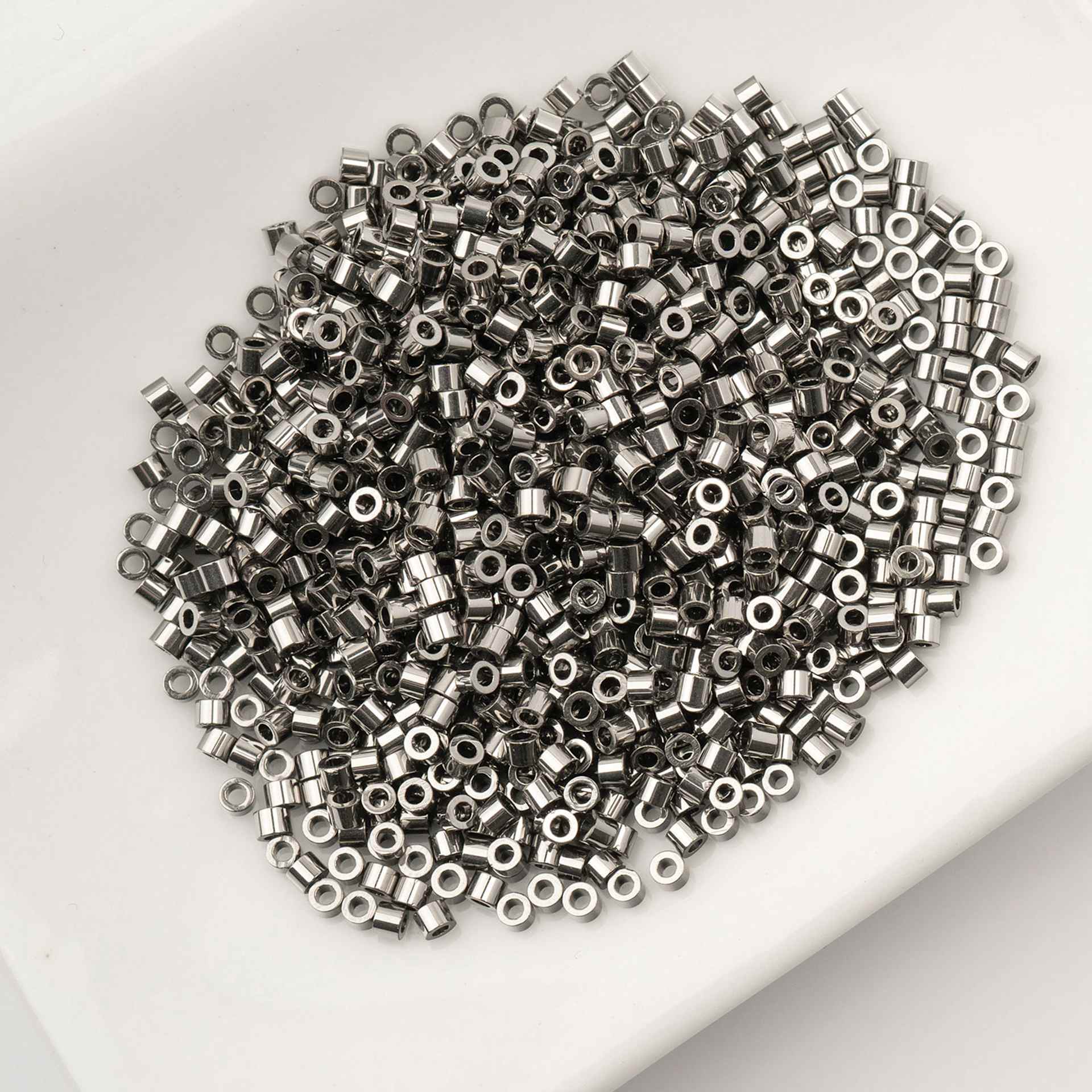 John Bead Cylin 11/0 Cylindrical Seed Beads - Steel sitting in dish