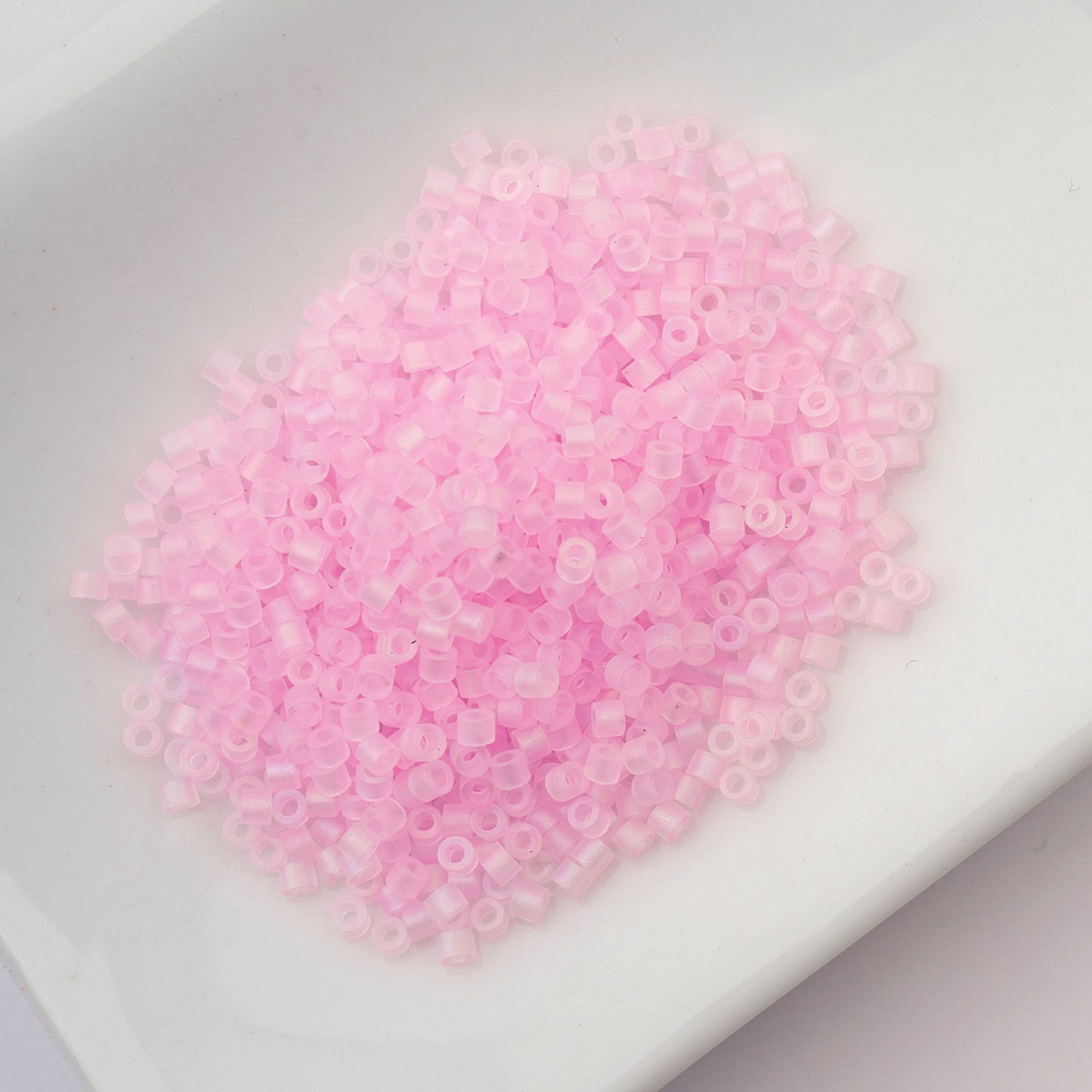 John Bead Cylin 11/0 Matte Macaron Cylindrical Seed Beads - Baby Pink AB sitting in dish