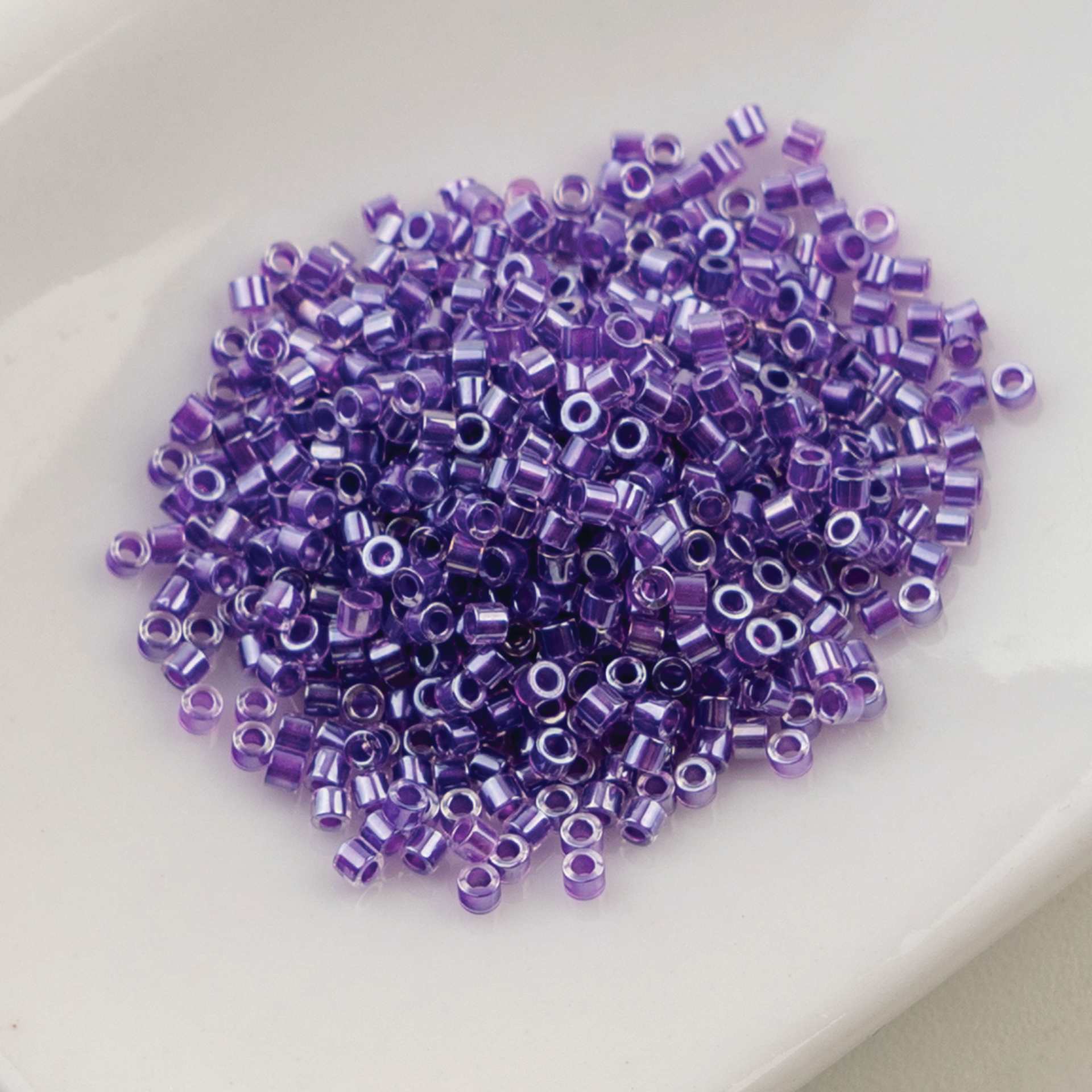 John Bead Cylin 11/0 Cylindrical Seed Beads - Lavender Gemdust sitting in dish