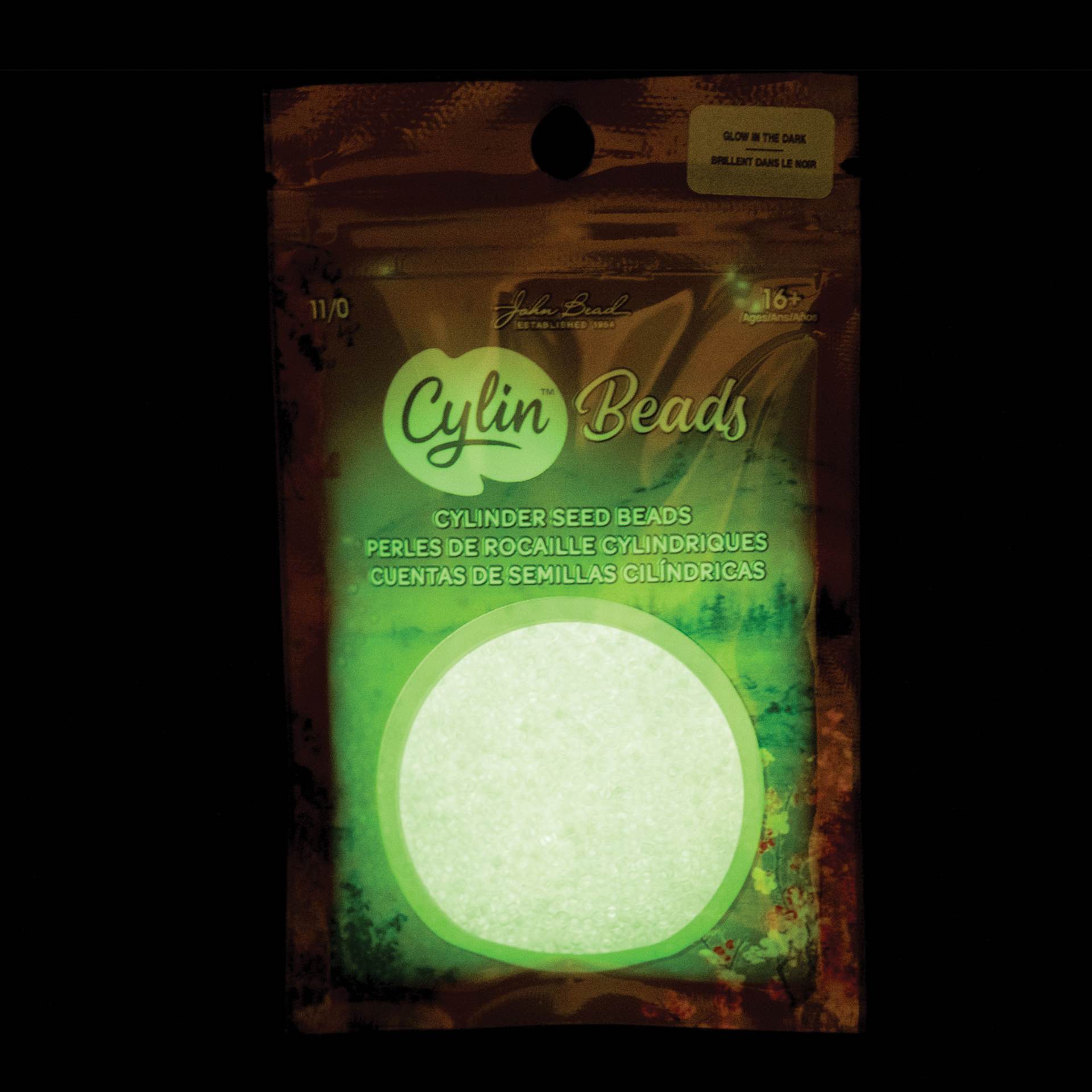 John Bead Cylin 11/0 Glow in the Dark Cylindrical Seed Beads - White to Green, 25g front of packaging to show glow effect