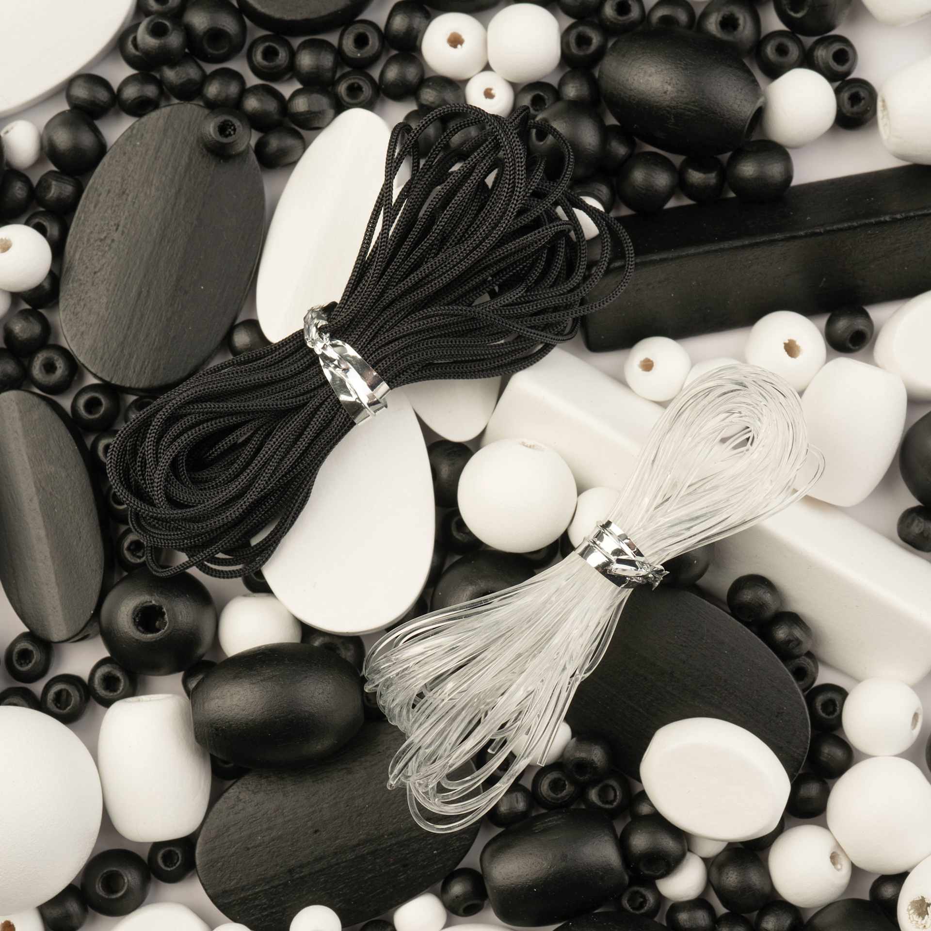 John Bead Wood Craft Beads - White and Black, 90 g Bag showing included nylon cords