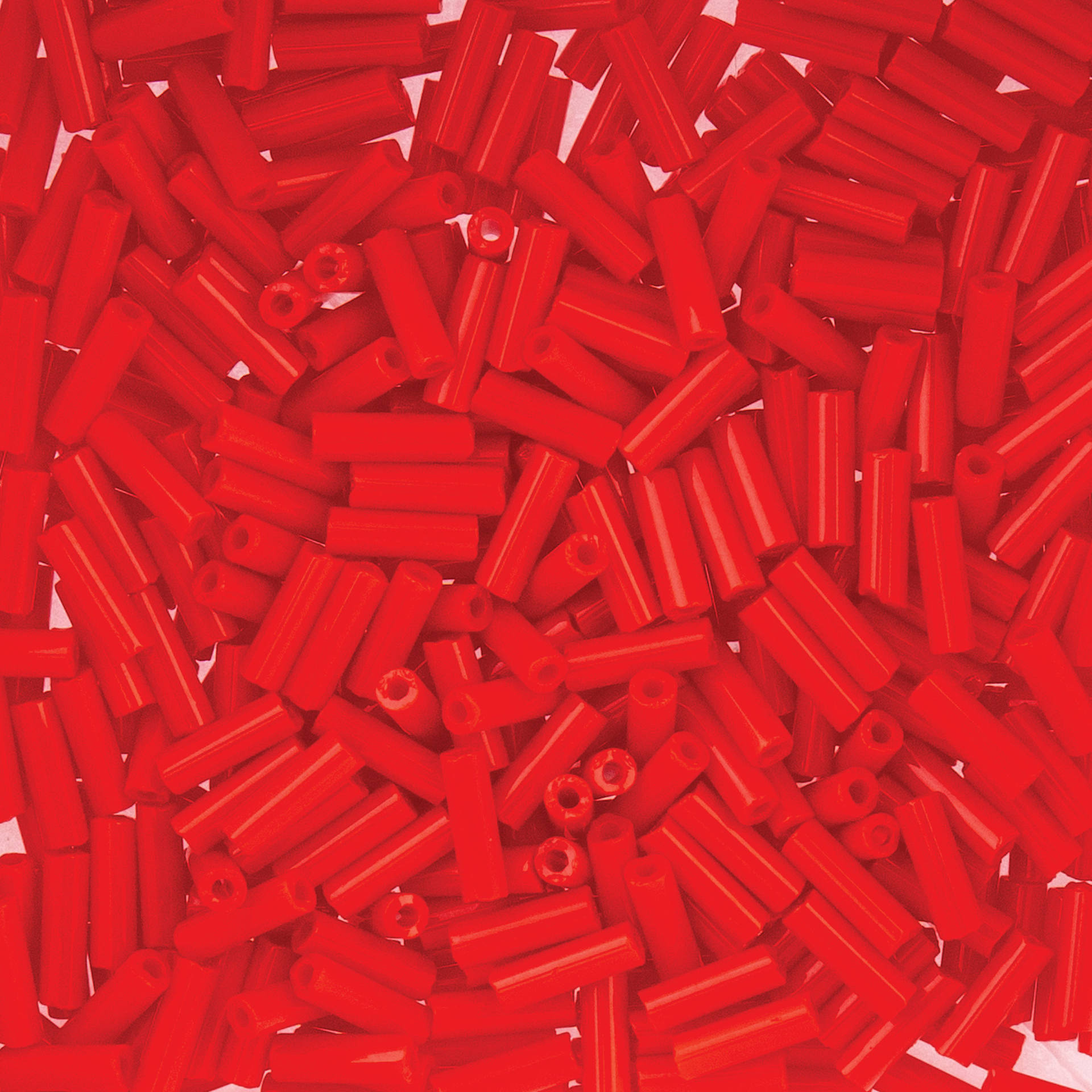 John Bead Czech Glass #3 Bugle Beads - Opaque Light Red close up