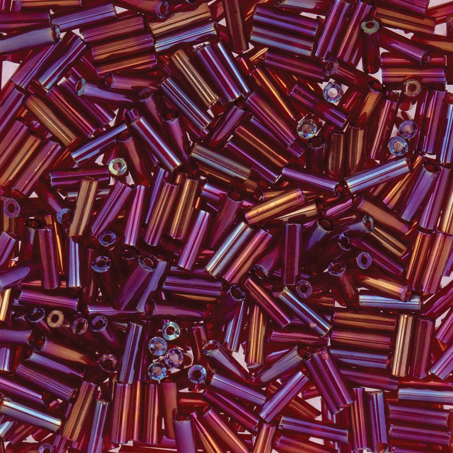 John Bead Czech Glass #3 Bugle Beads - Transparent Red Iris close up