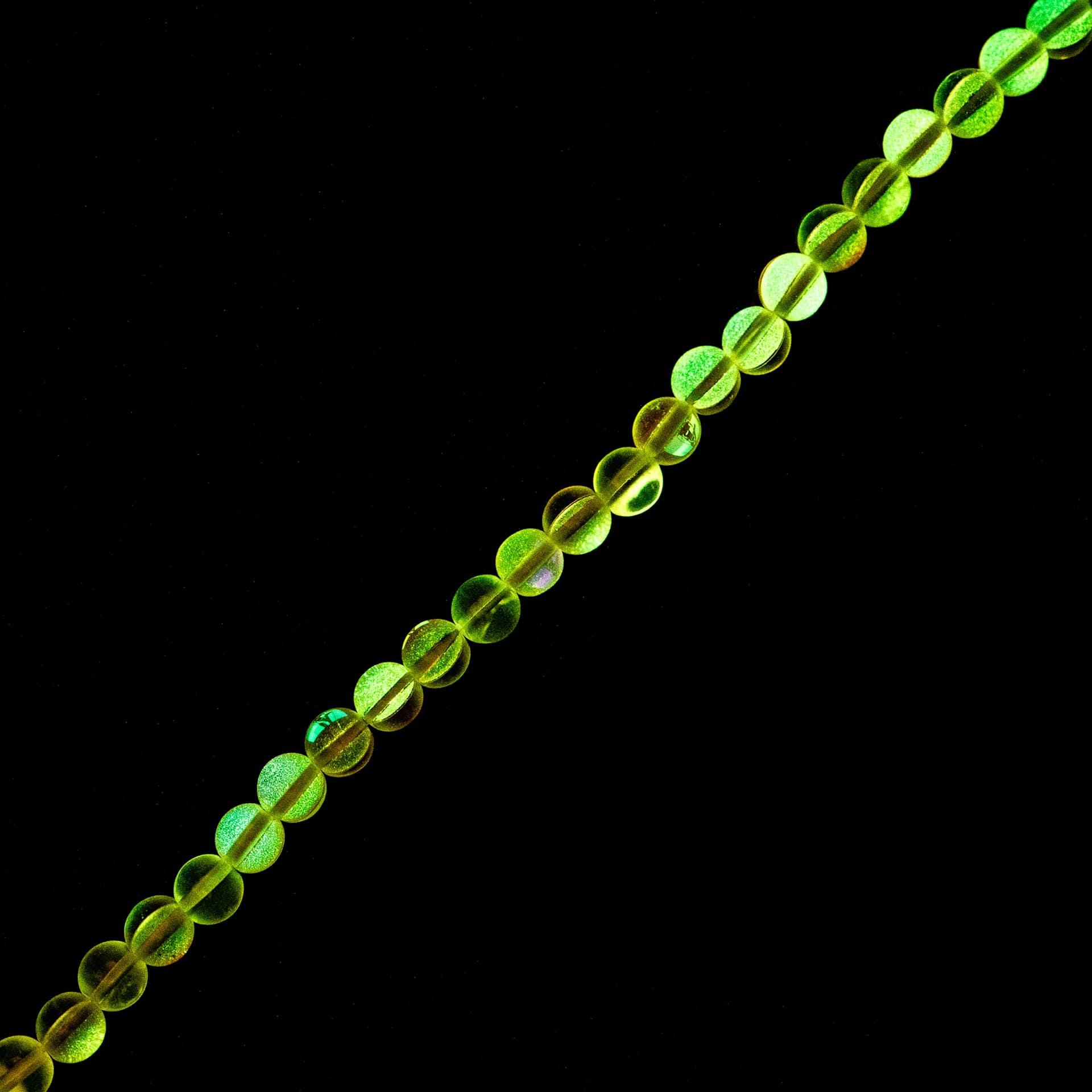 John Bead Crystal Lane DIY Glow in the Dark Round Bead Strand - Pink AB, 7 in showing glow effect