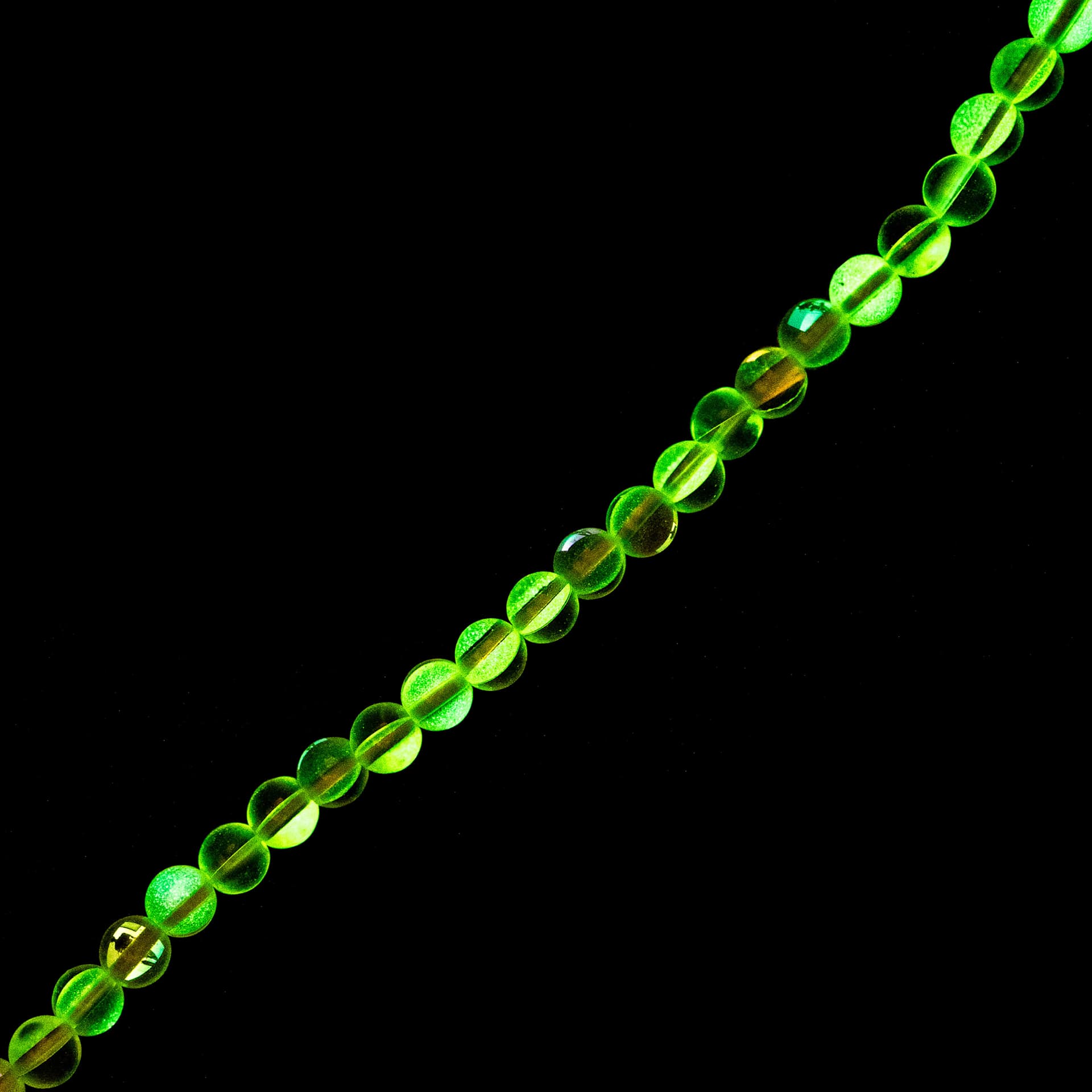 John Bead Crystal Lane DIY Glow in the Dark Round Bead Strand - Yellow AB, 7 in showing glow effect