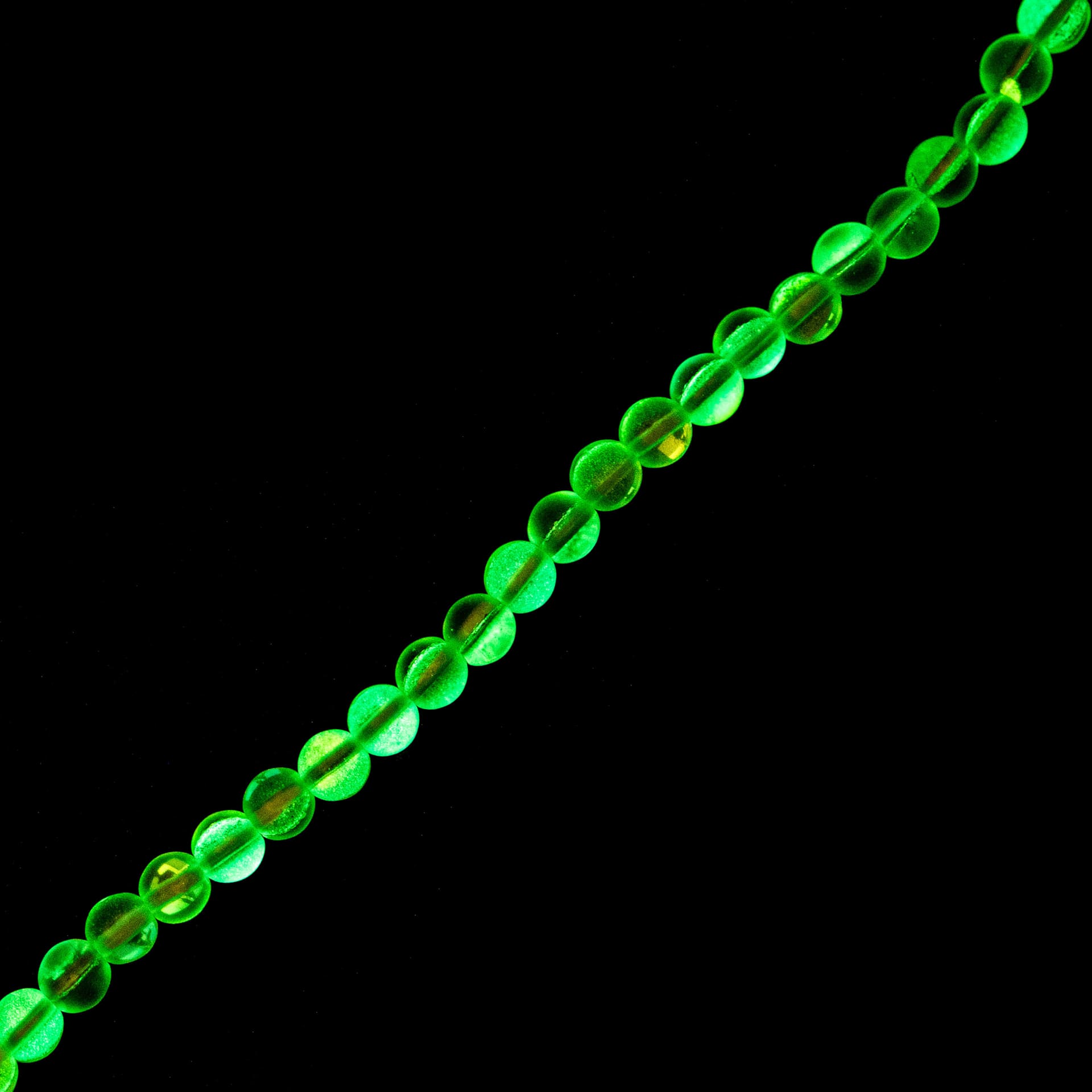 John Bead Crystal Lane DIY Glow in the Dark Round Bead Strand - Light Blue AB, 7 in showing glow effect