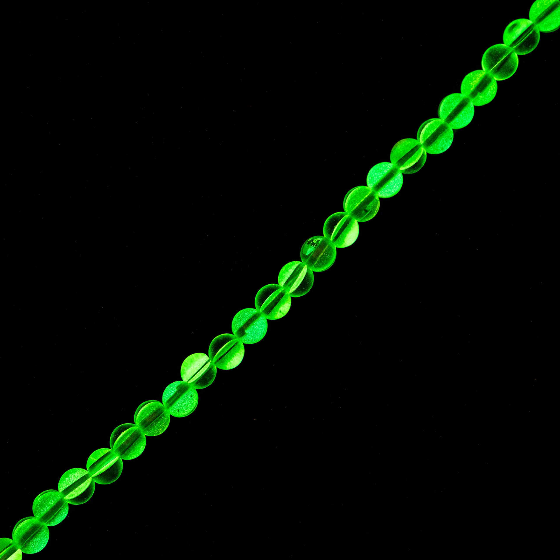 John Bead Crystal Lane DIY Glow in the Dark Round Bead Strand - Green AB, 7 in showing glow effect