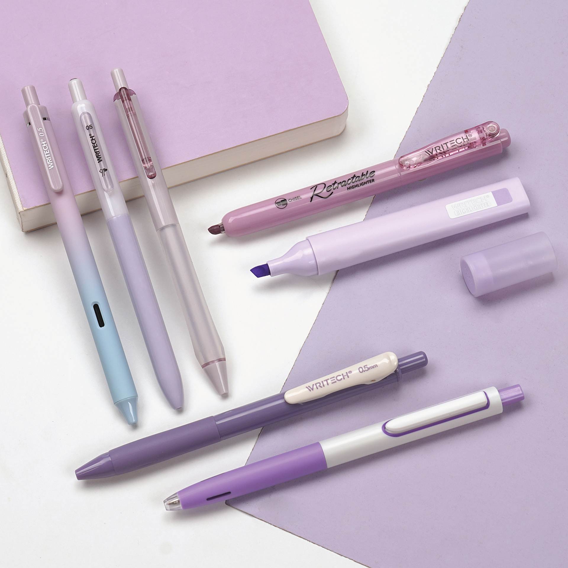 Writech Color Coded Writing Set - Set of 7, Provence, contents on table with purple stationary