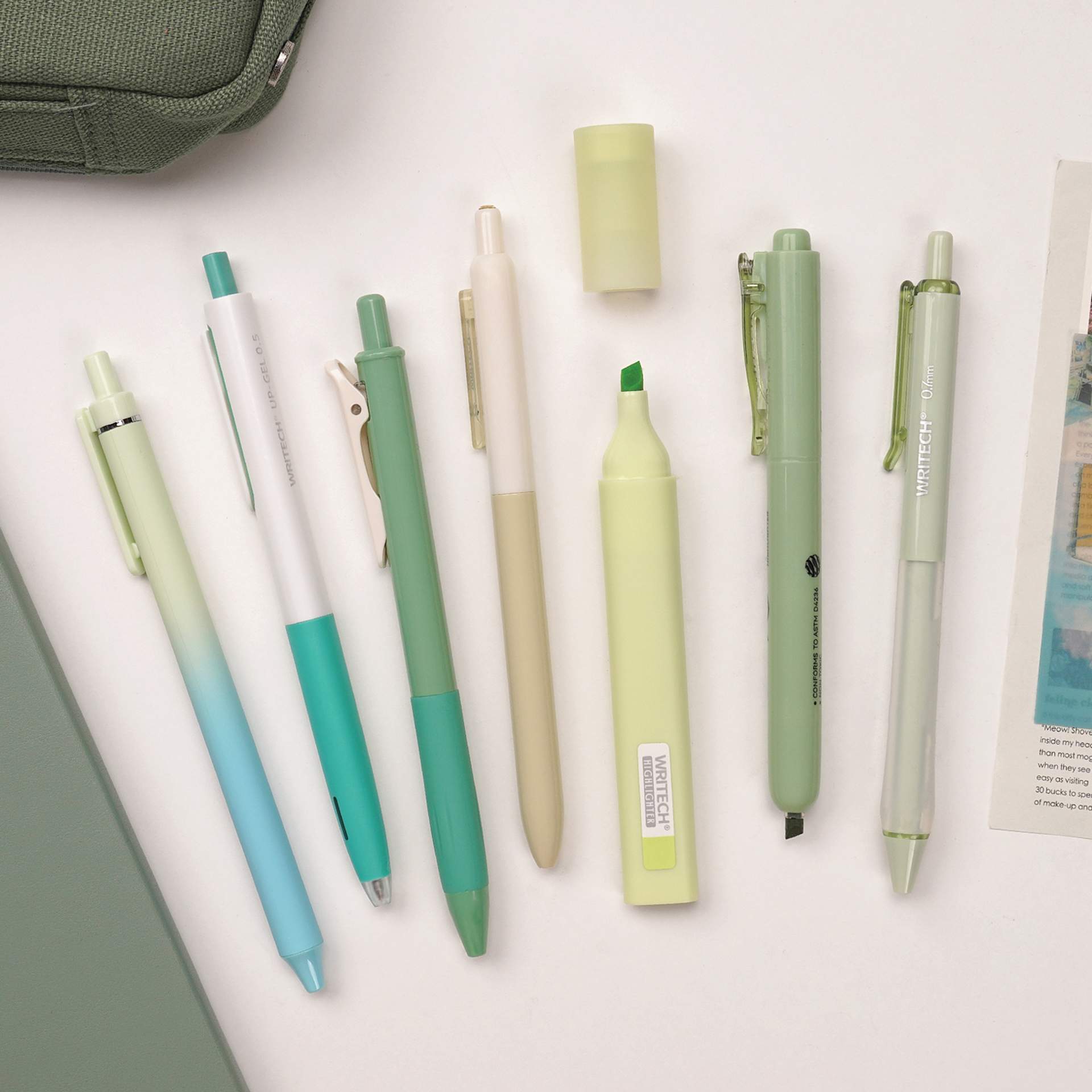 Writech Color Coded Writing Set - Set of 7, Vibrant Forest, contents fanned out on tabletop