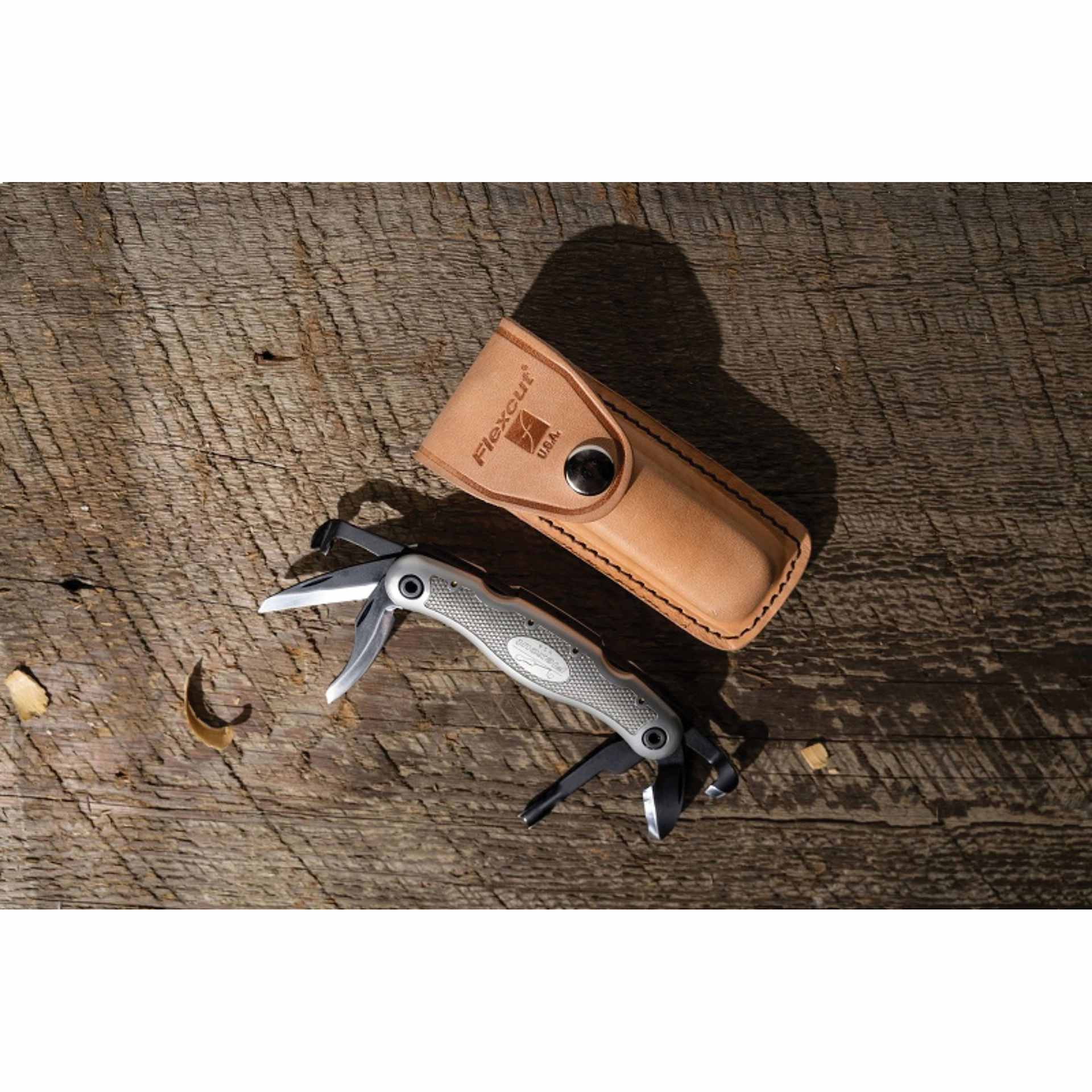 Flexcut Carvin' Jack 2.0 Folding Knife - Right-Handed - on workbench with leather sheath