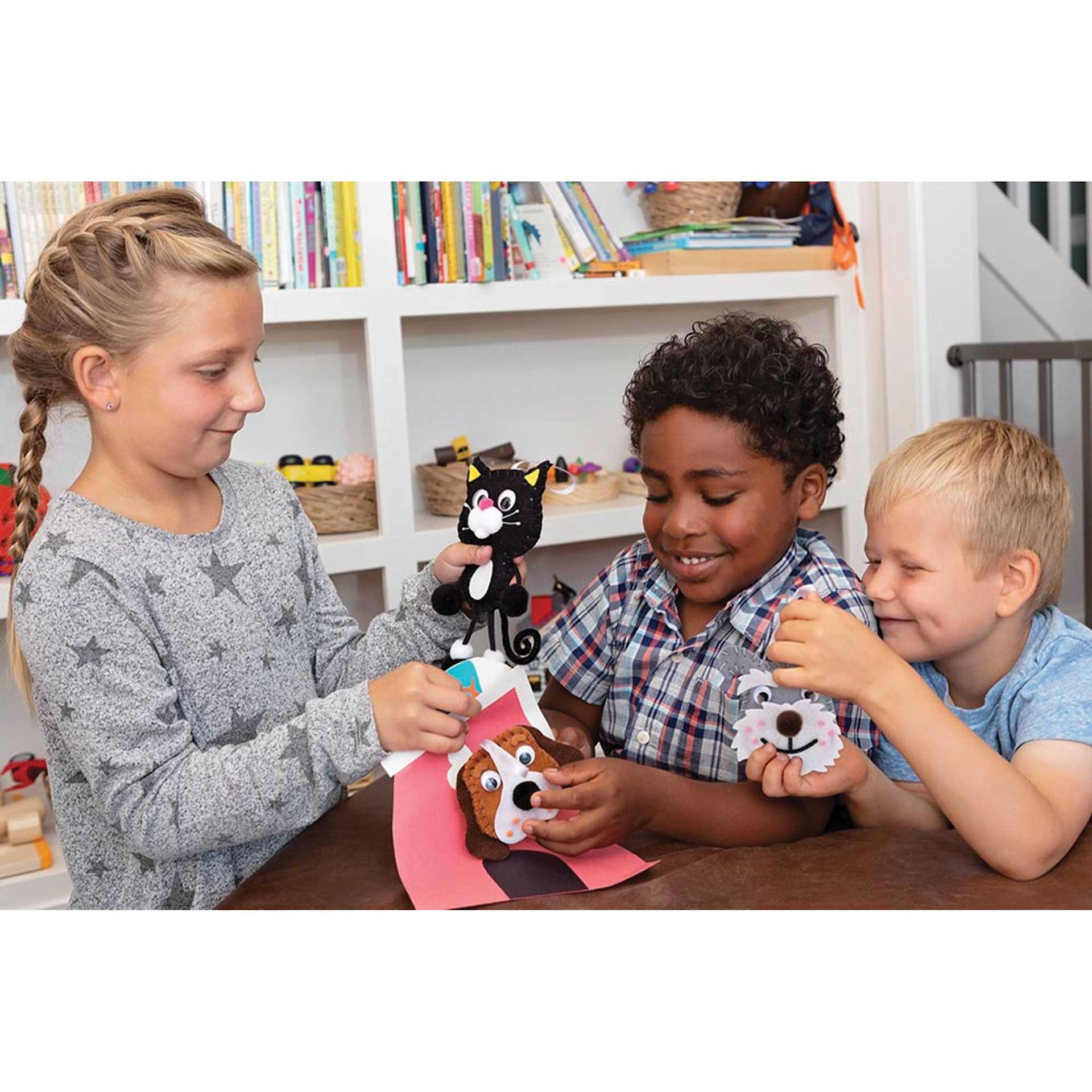 Creativity Street Felt Sewing Kits (kids playing with finished felt animals)