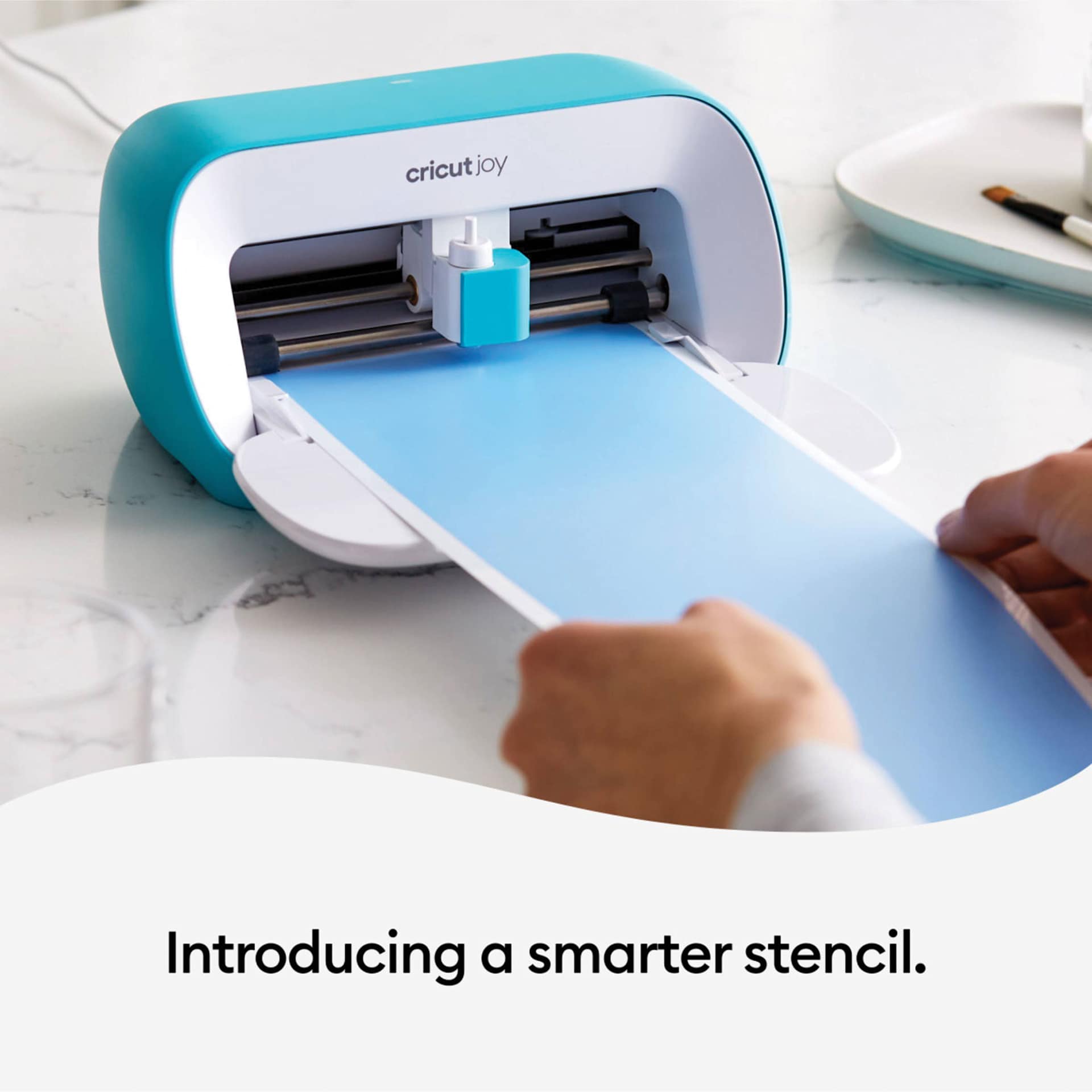 Cricut Joy Smart Stencil Film being loaded into Cricut Joy machine
