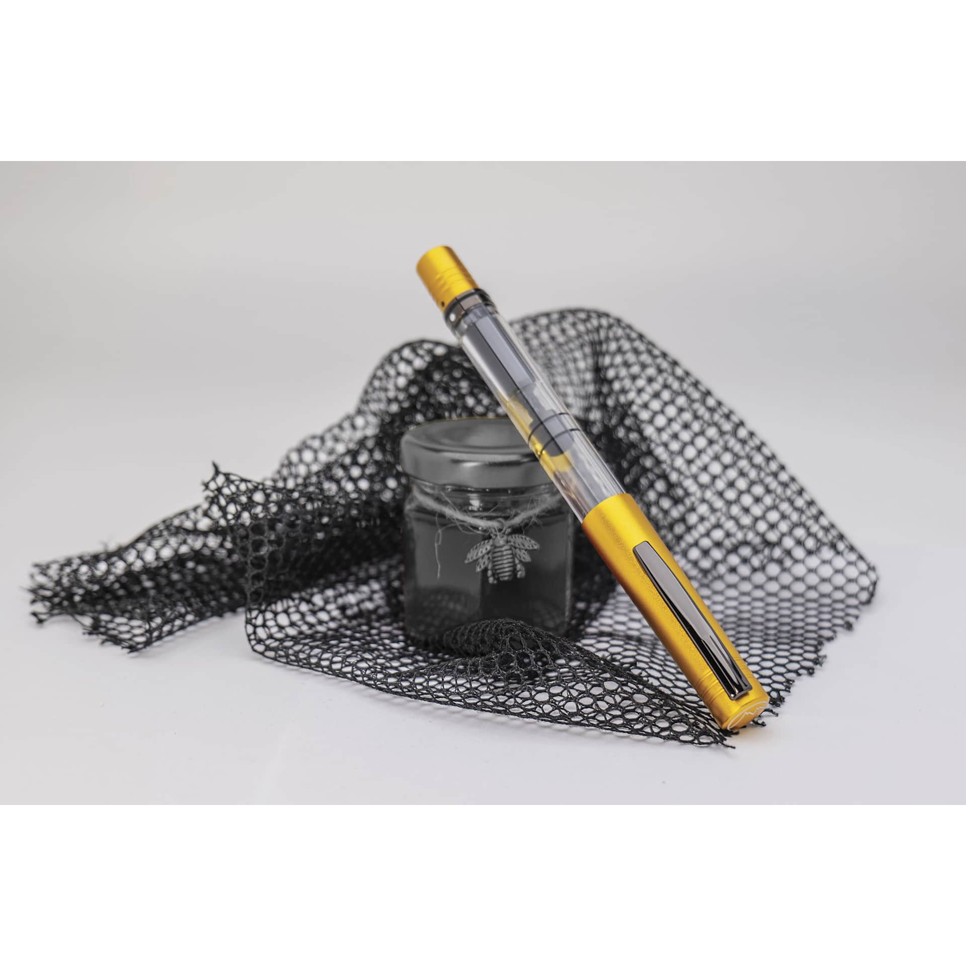 Monteverde MP1 Fountain Pen - Honey Yellow, Fine Nib, propped up with ink bottle