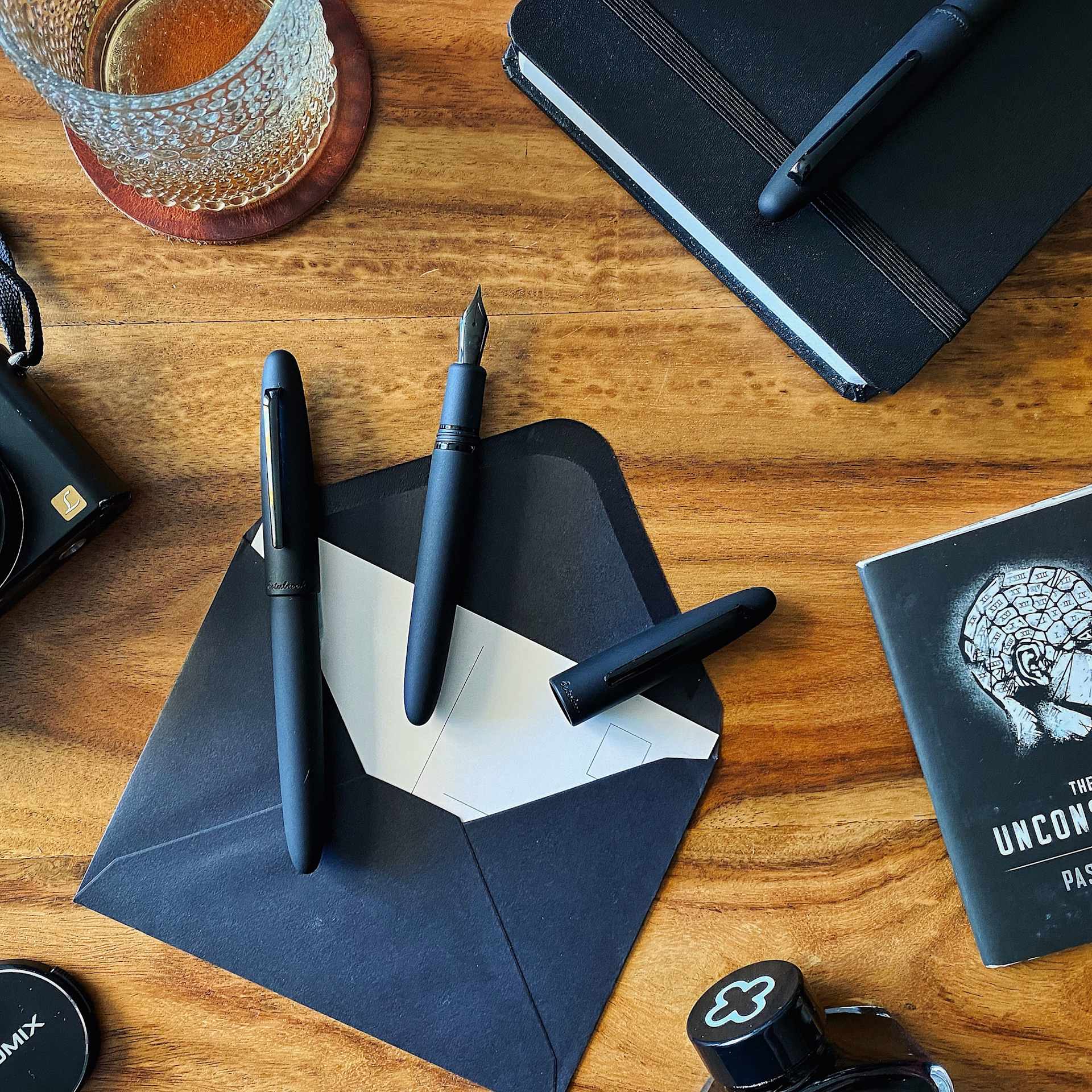 Esterbrook Estie Fountain Pen - Raven Matte Black pens on desk with stationary