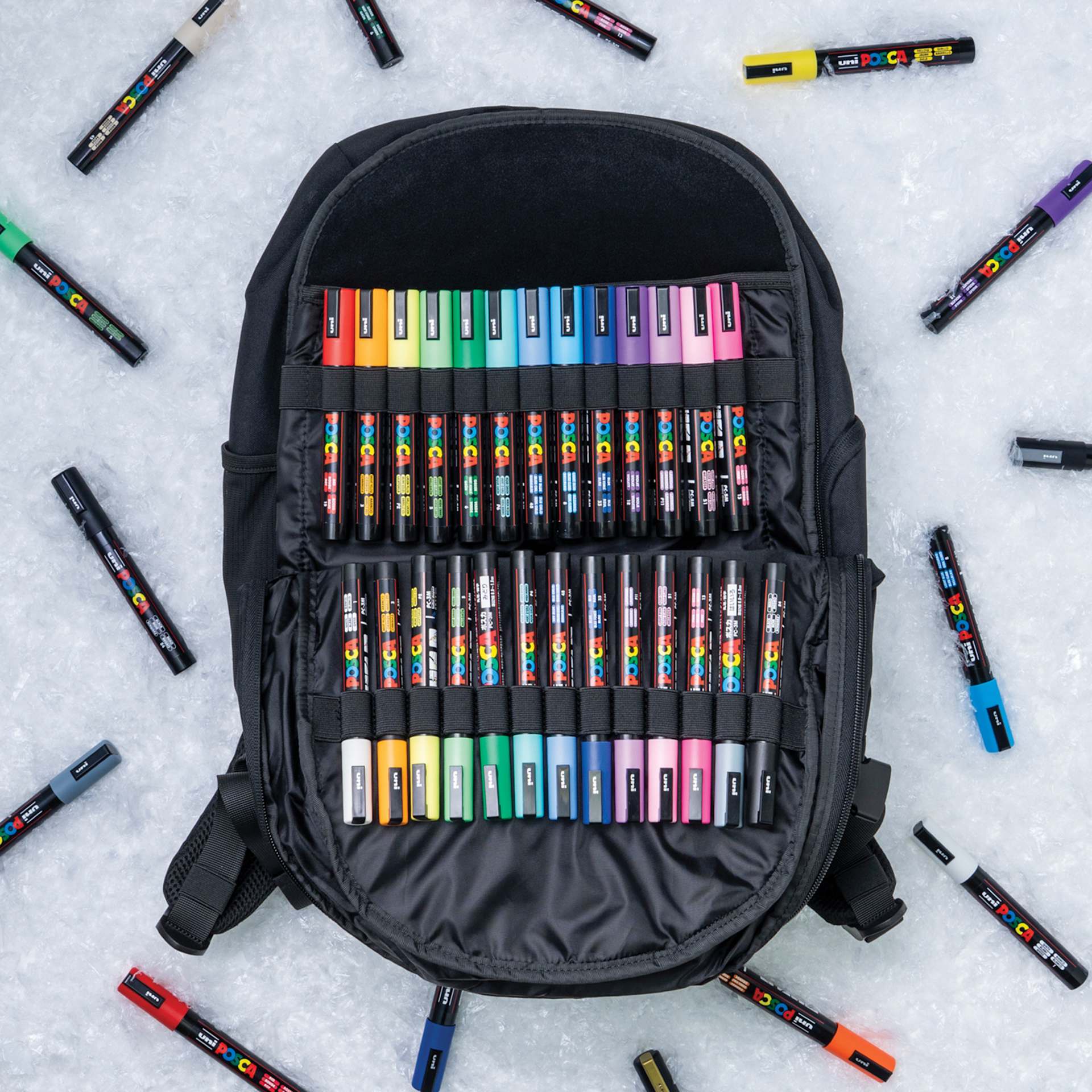 Posca Artist Marker & Pencil Backpack Bundle, open, showing markers inside and outside the backpack