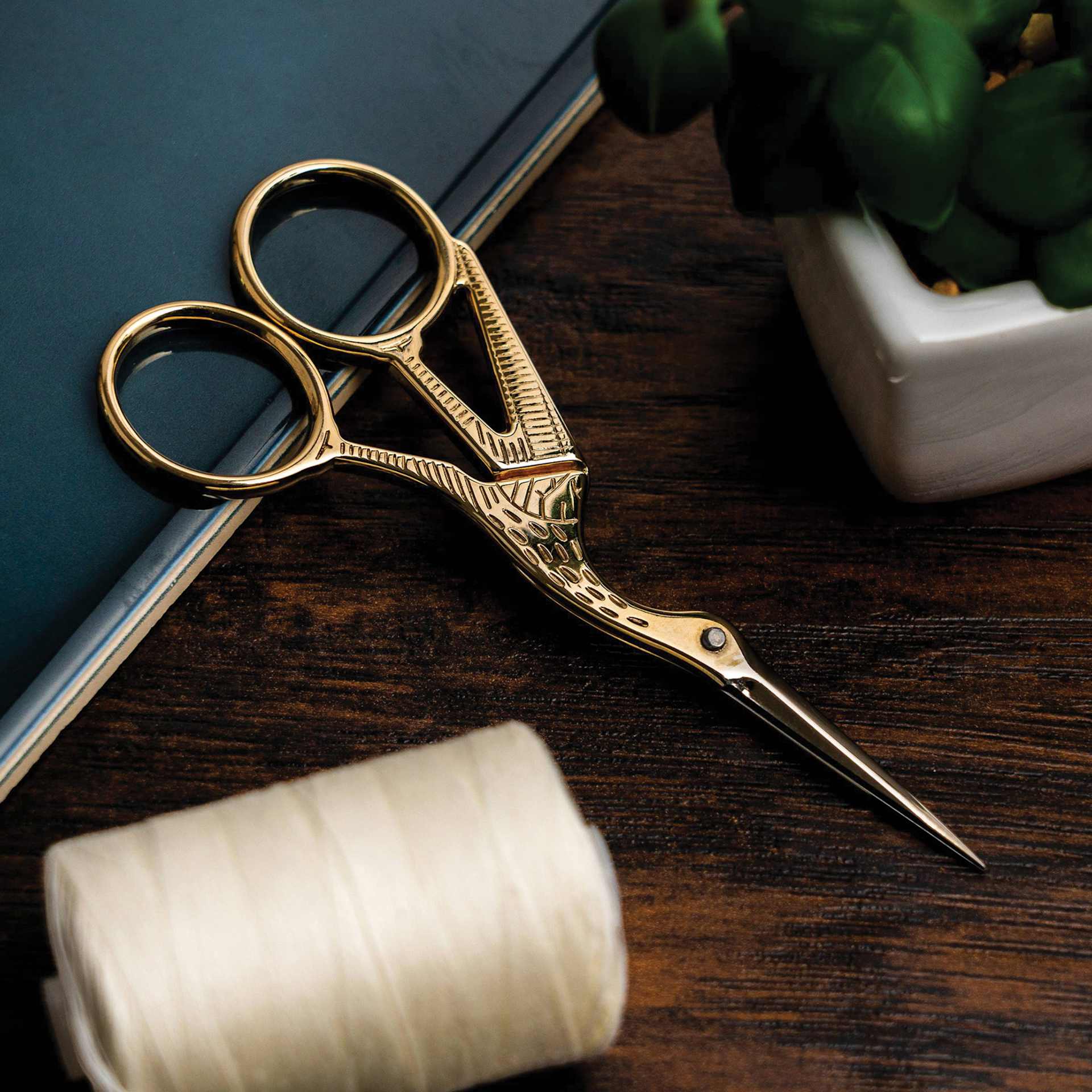 Singer Stork Embroidery Scissors - laying on table