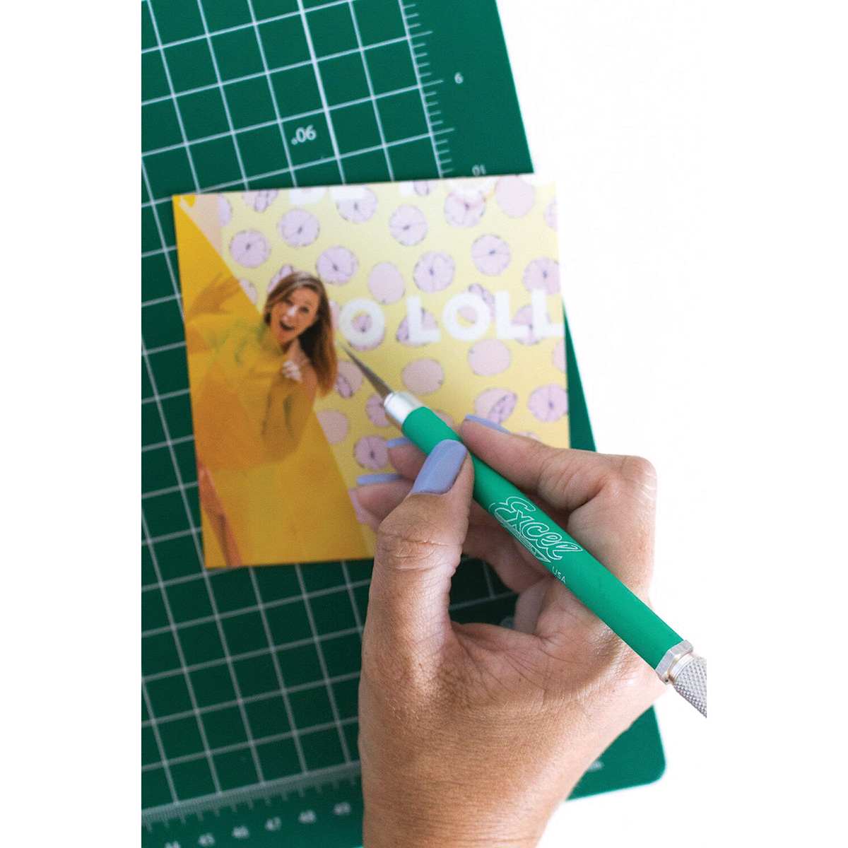 Excel Blades K18 Cushion Grip Knife - Green Knife shown cutting letters