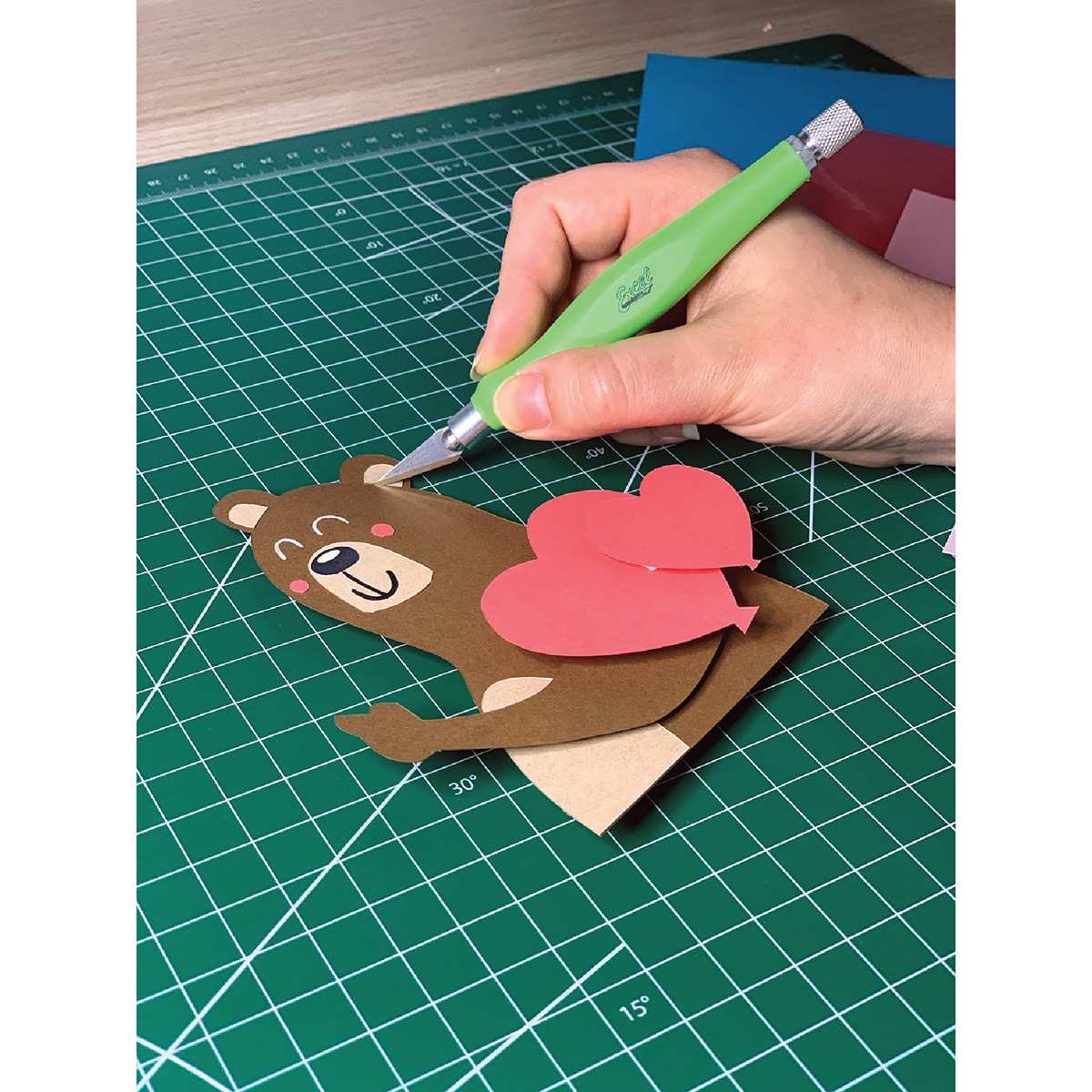 Excel Blades FitGrip Knife - Artist cutting out cartoon bear using Green knife