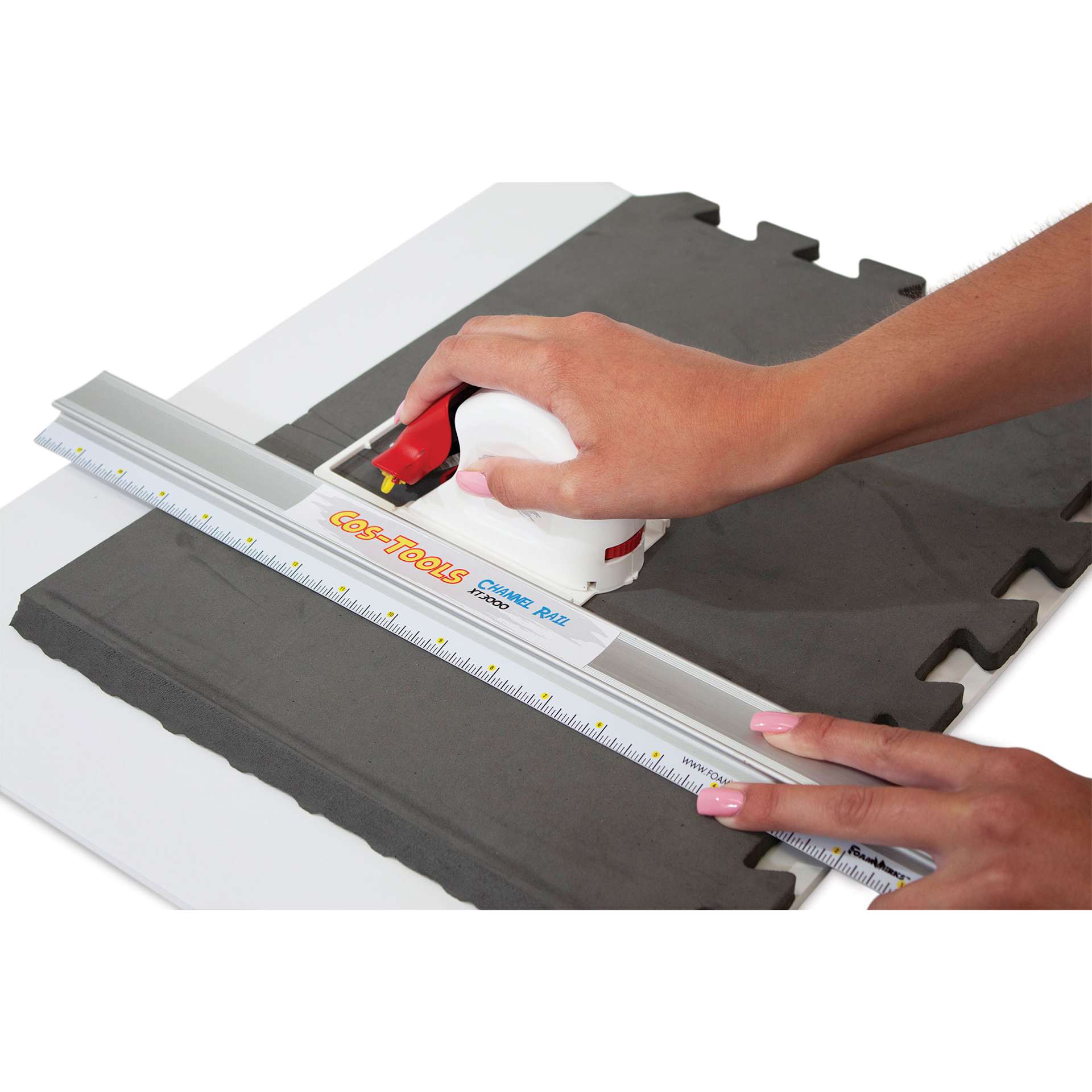 Logan Cos-Tools V-Groove Cutter, in hand cutting foarm board with a straight edge (not included)