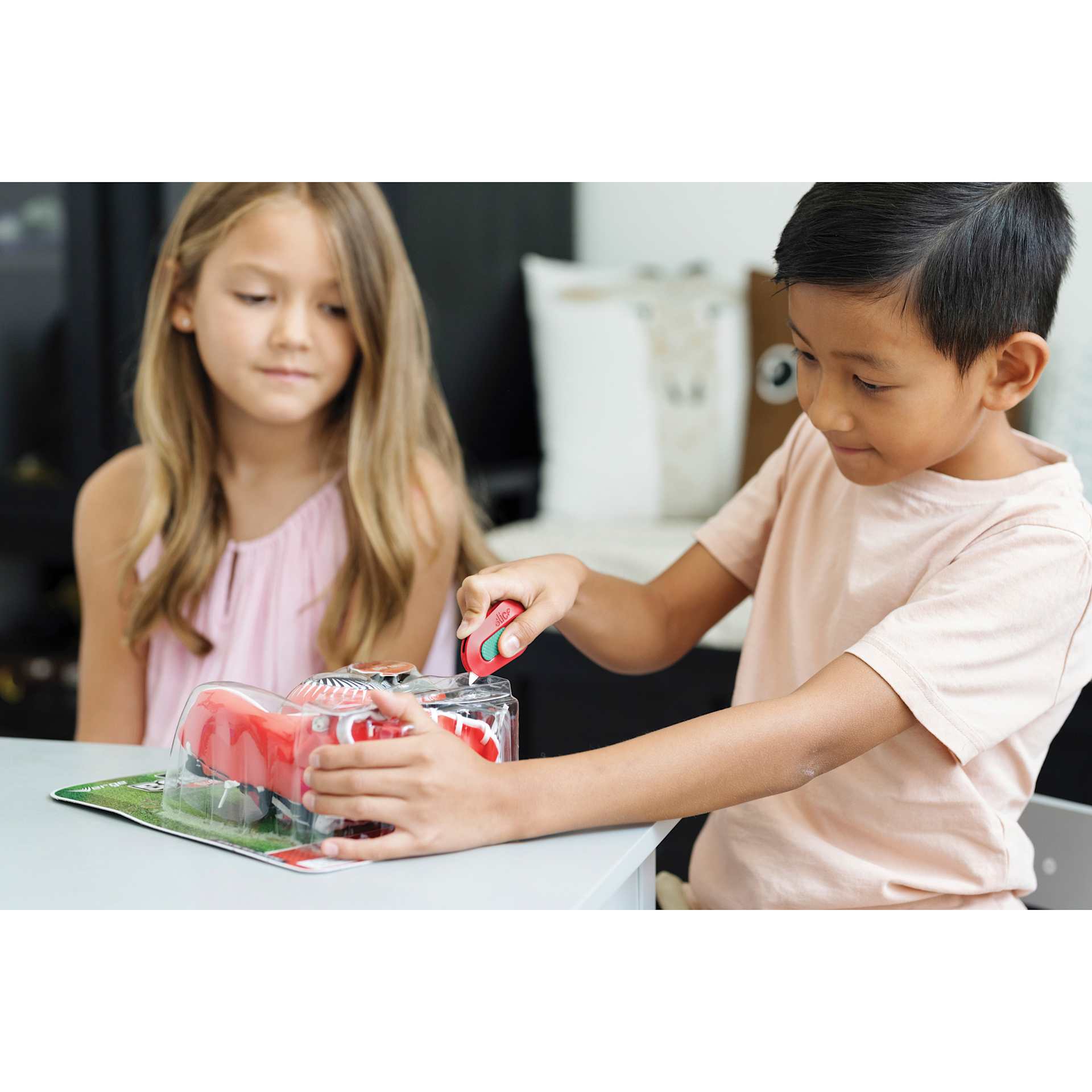 Slice Mini Cutter - Orange - in use by child