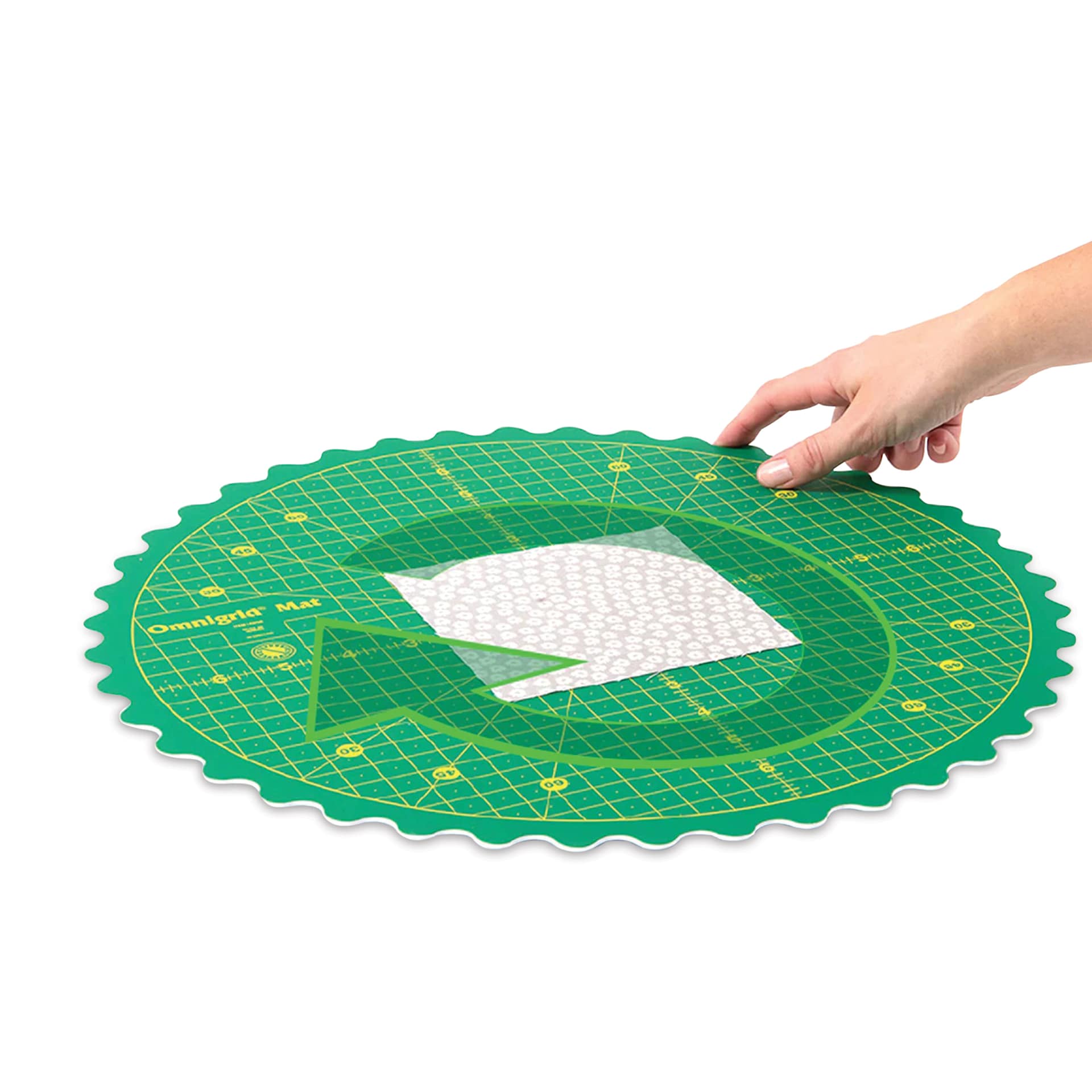 Omnigrid 360 Rotating Cutting Mat - Green/Yellow, 14" - demonstrating rotation
