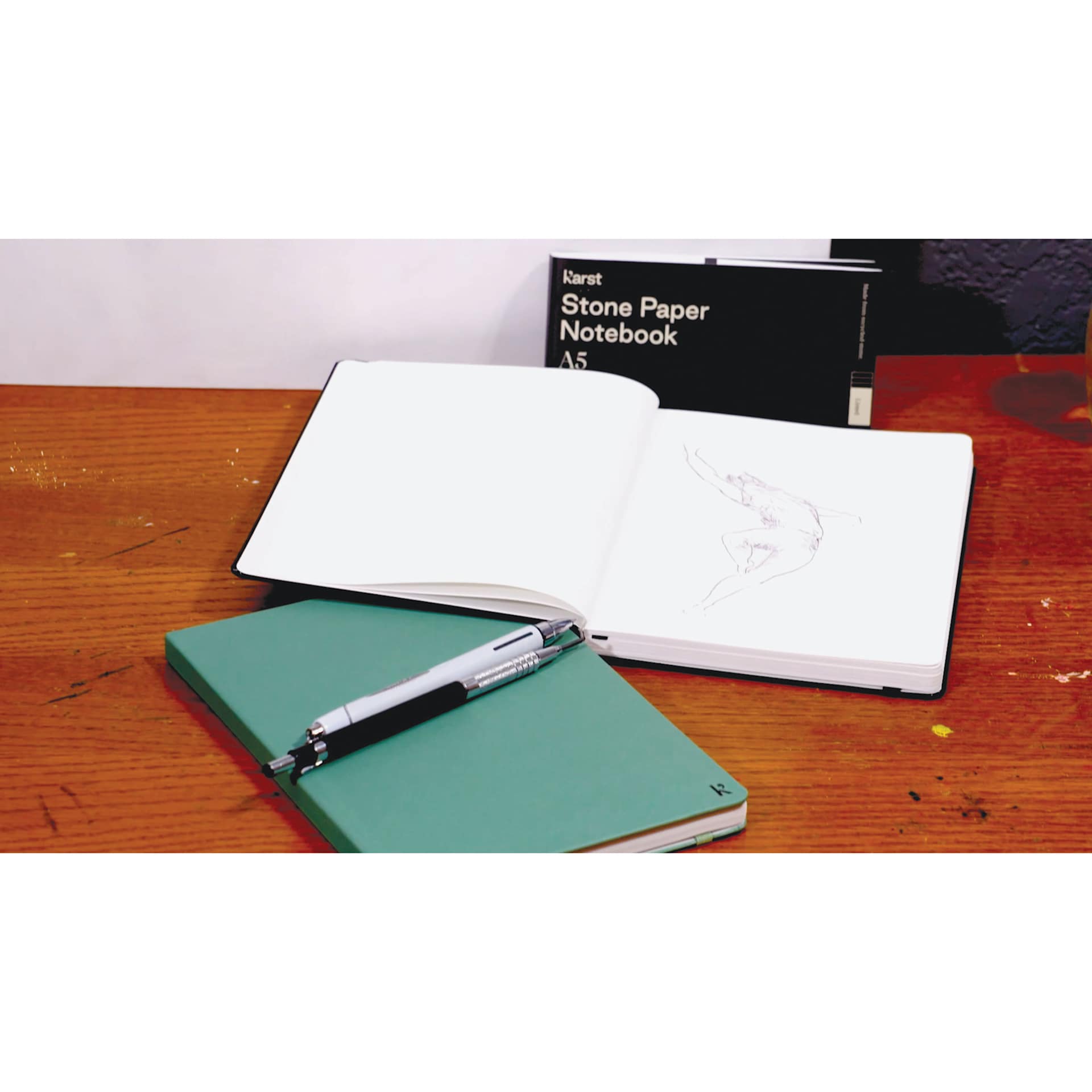Karst Stone Paper Notebooks, on desk