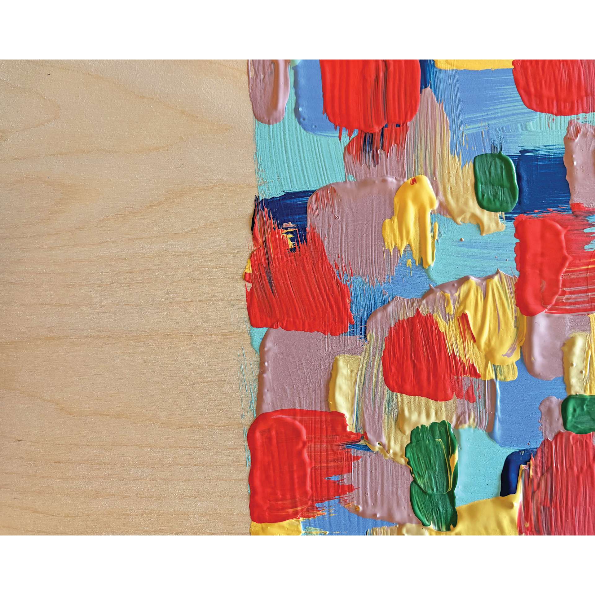 Paint applied in thick swatches to the Ampersand Woodpanel.