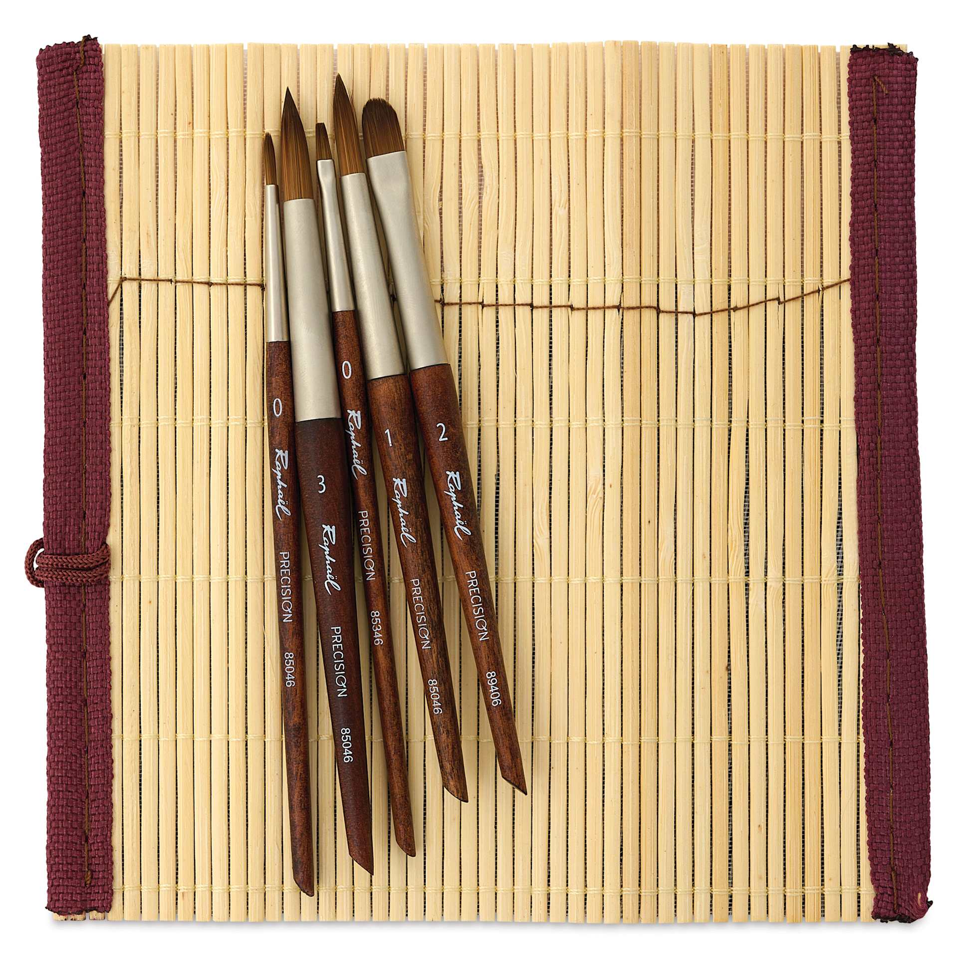 Raphaël x Monet Mini Watercolor Brush Set, brushes resting on bamboo travel roll