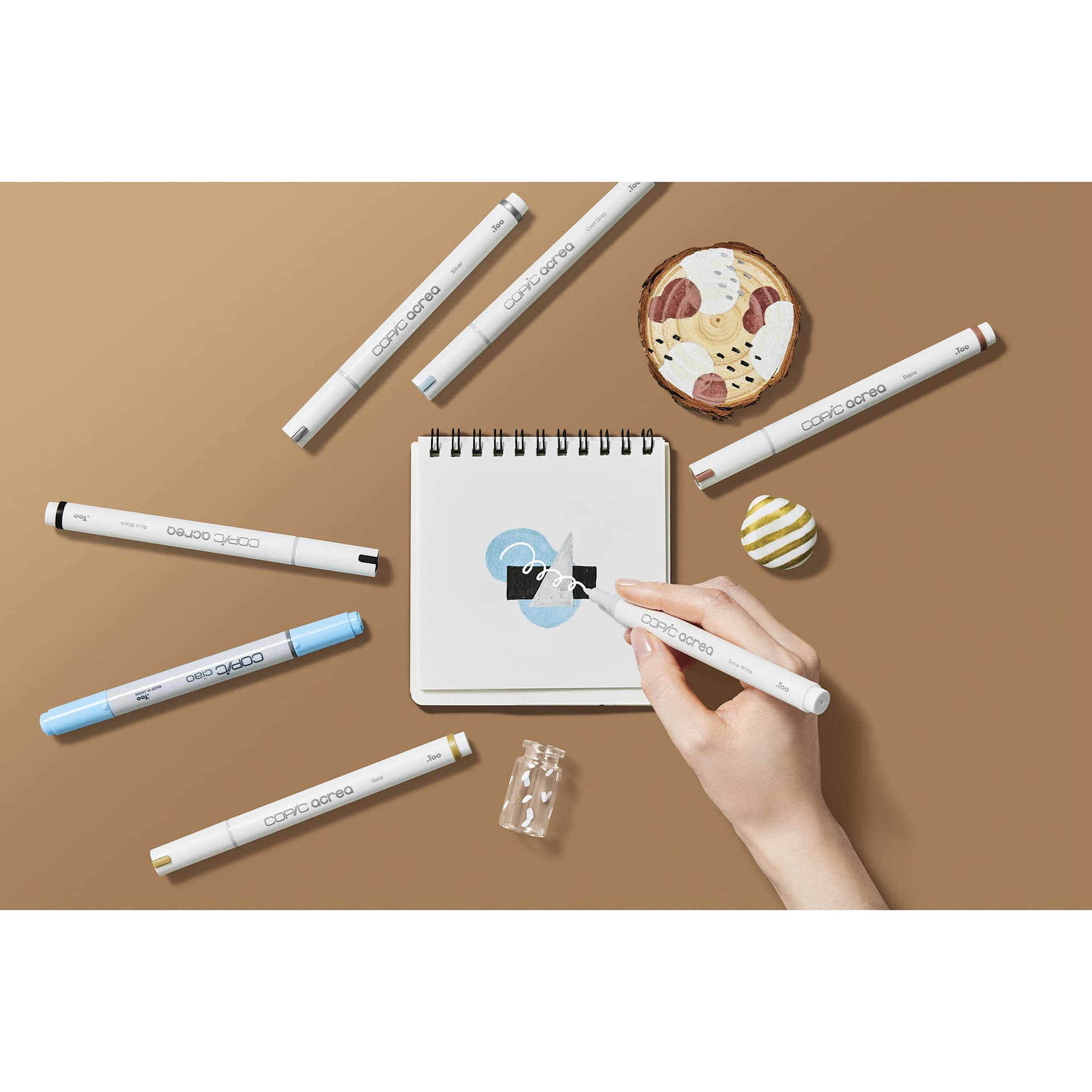 Copic Acrea Paint Markers - Essentials Colors, Set of 6, marker in hand coloring a drawing