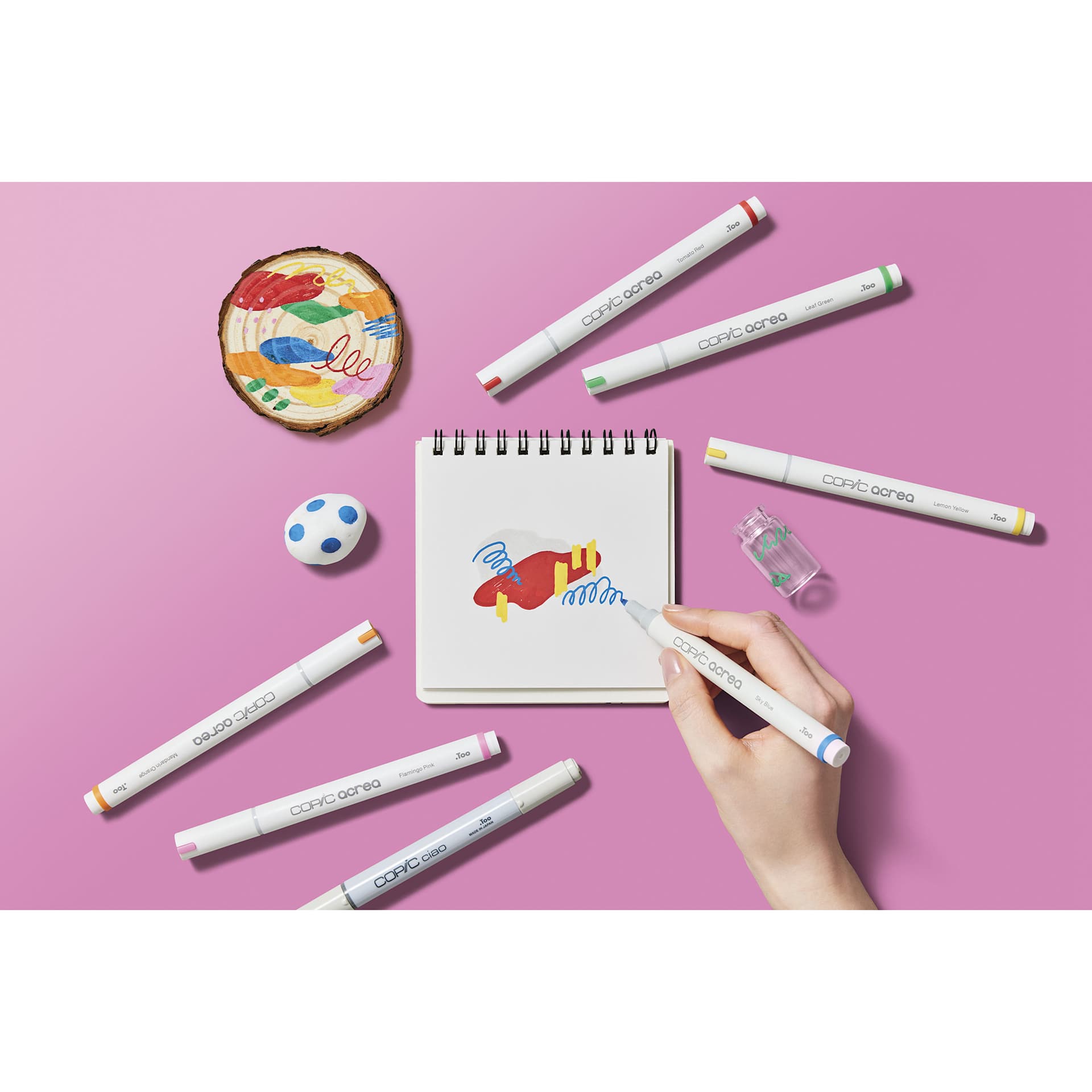 Copic Acrea Paint Markers - Vivid Colors, Set of 6, marker in hand coloring a drawing