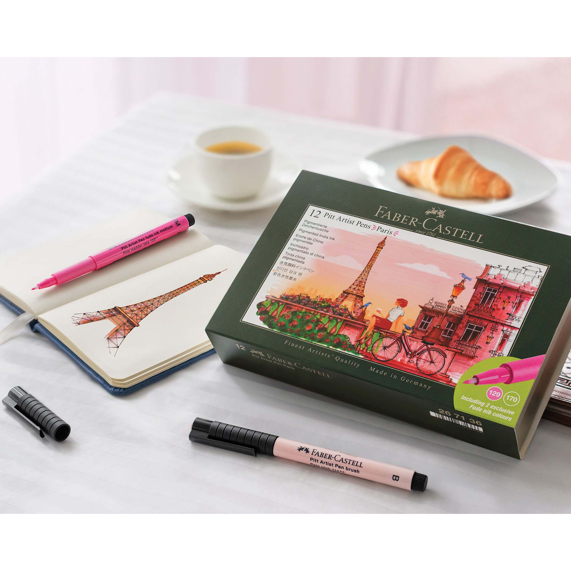 Faber-Castell Pitt Artist City Collection Brush Pens - Set of 12, Paris, with a sketching of the Eiffel tower in a journal.