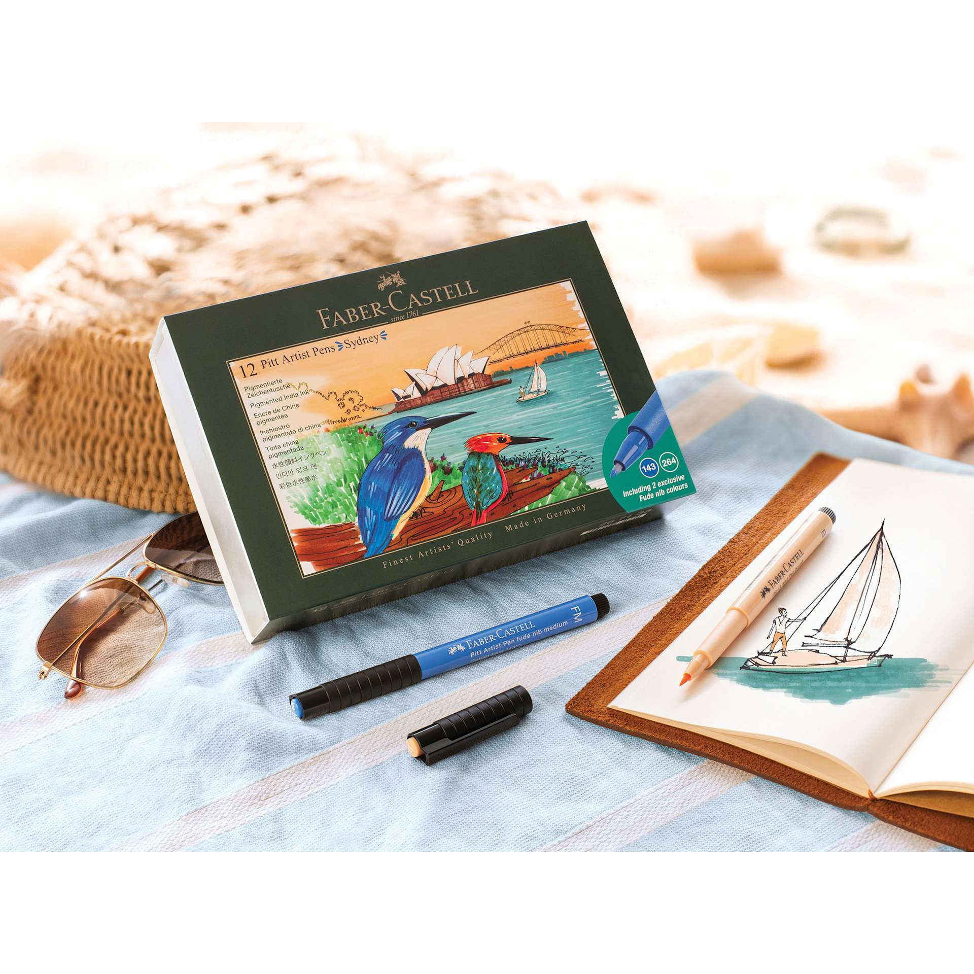 Faber-Castell Pitt Artist City Collection Brush Pens - Set of 12, Sydney, with a skething of a sailboat in a journal.