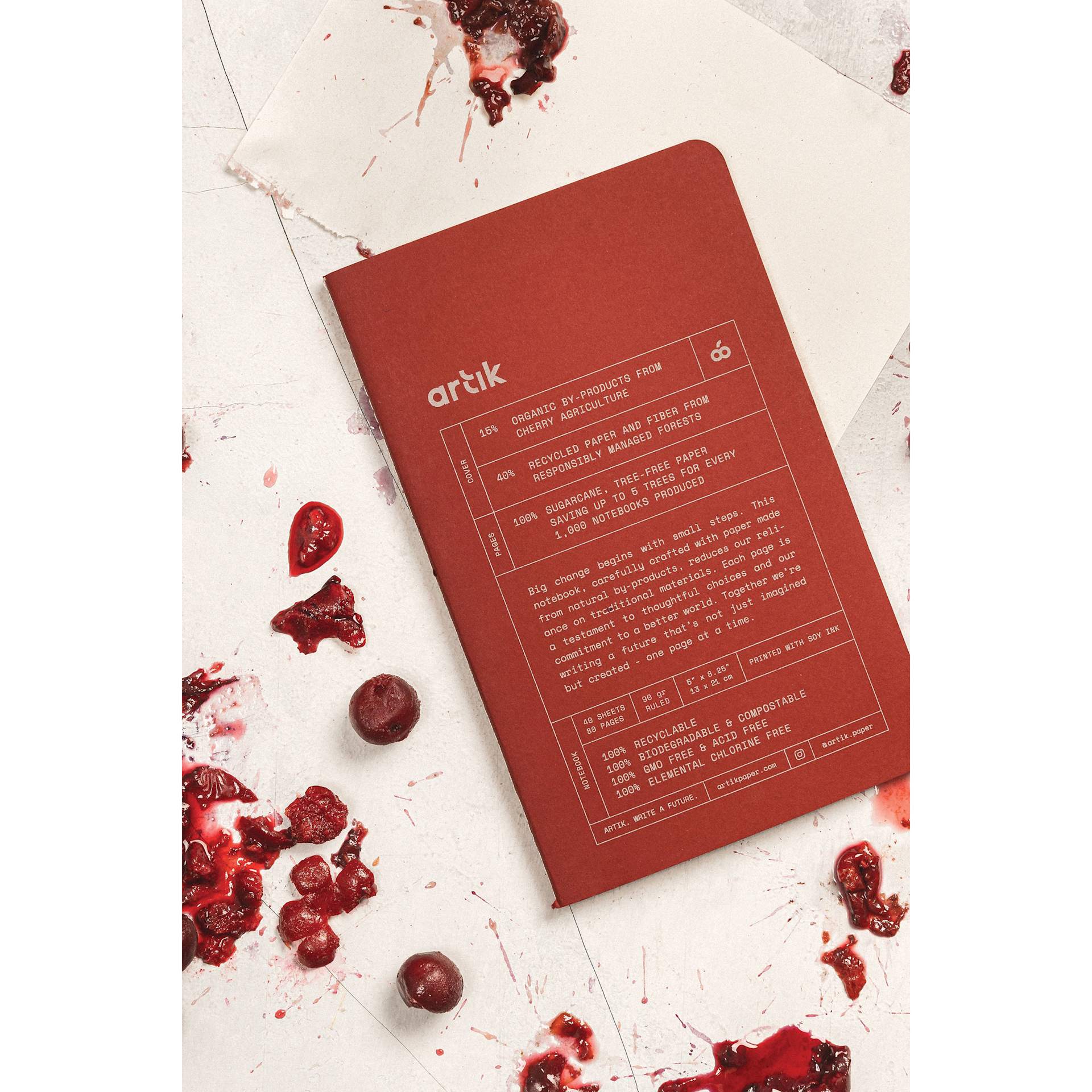 Artik Singer Sewn Notebook - Cherry, 5" x 8-1/4", Ruled, Pkg of 2, on table