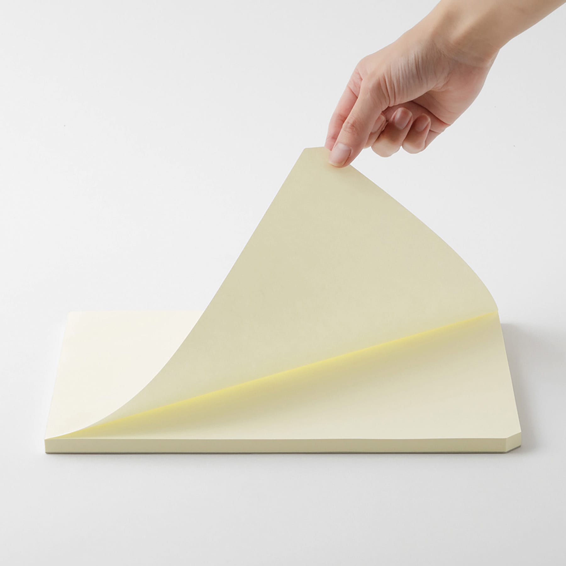 Midori MD Paper Pad - A4, Blank, White, 90 Sheets, sheet being lifted