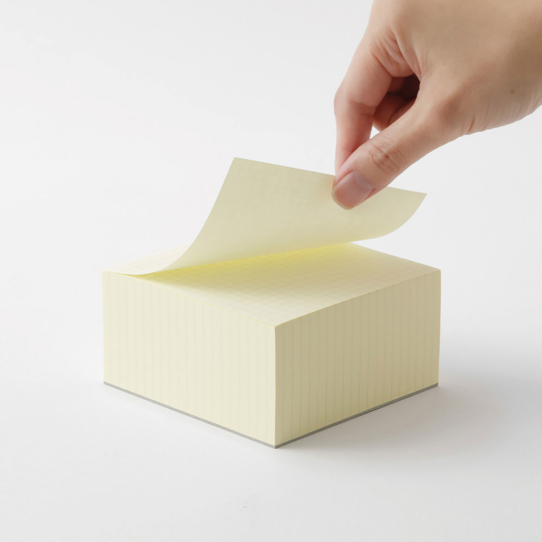 Midori MD Memo Block - 3.9" x 3.9", Grid, White, sheet being lifted