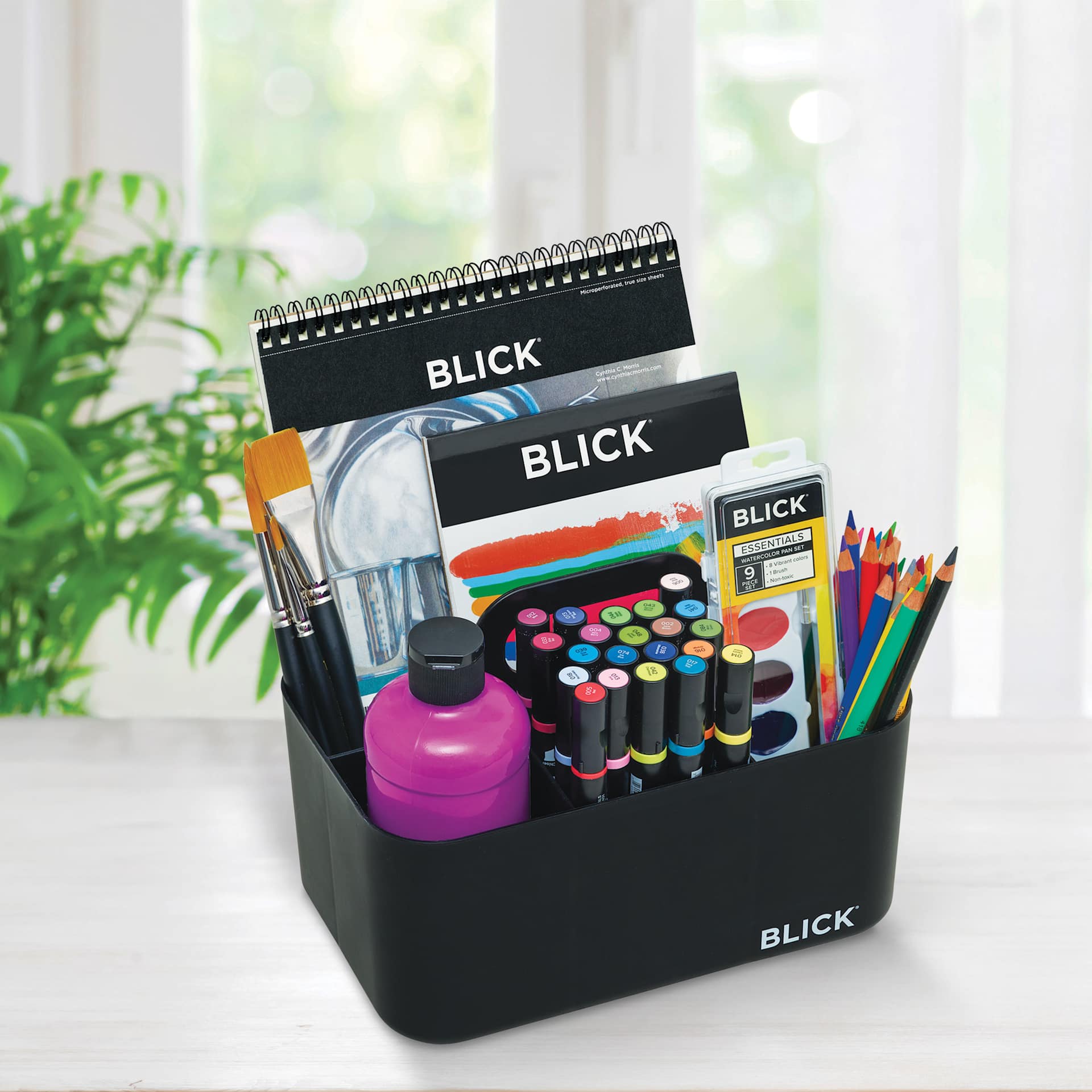 Blick Storage Caddy - Black on a counter, filled with art supplies (sold separately) 