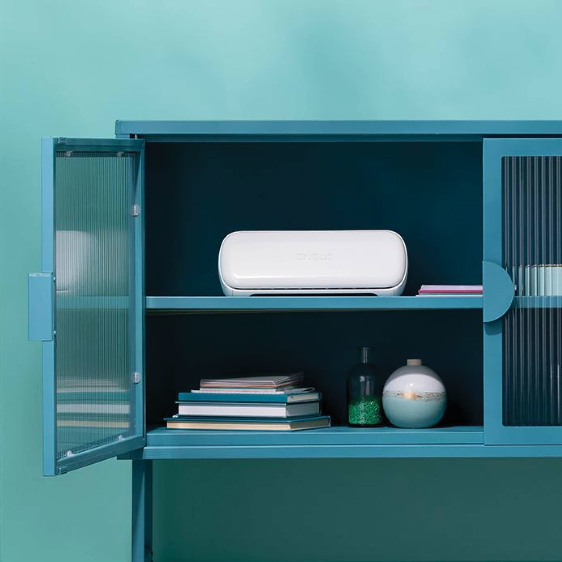Cricut Joy Xtra stored inside cabinet