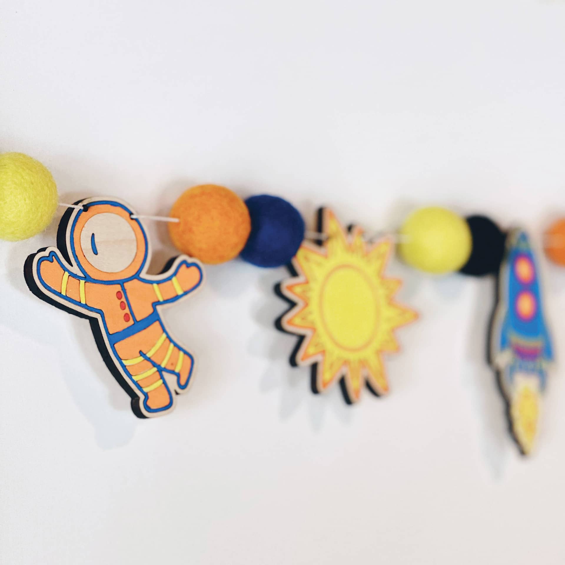 Woodsy Craft Co. DIY Garland Kit - Outer Space - close-up of finished garland example