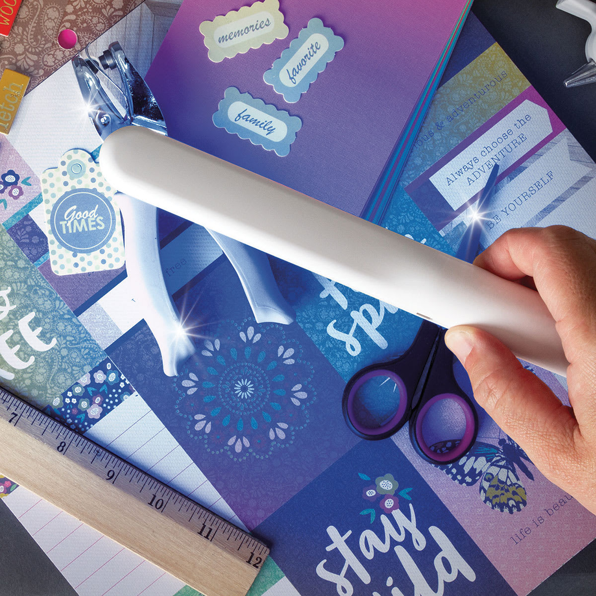 OttLite Rechargeable UVC Disinfecting Wand (Person using disinfecting wand to disinfect craft supplies)