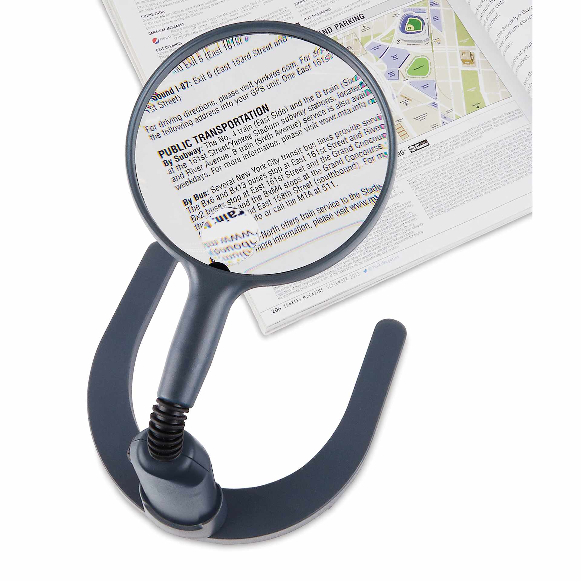 Carson MagniLamp LED Magnifier demonstrating magnification over book