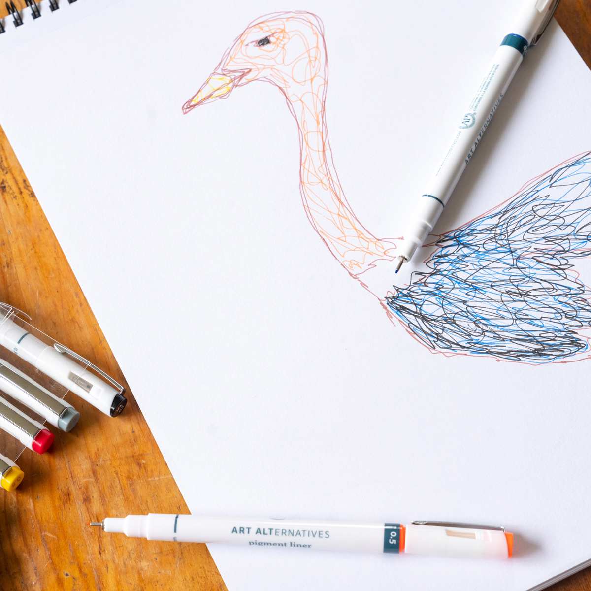 Art Alternatives Pigment Liner - Set of 12, Assorted Colors, .45 being used to draw ostrich illustration