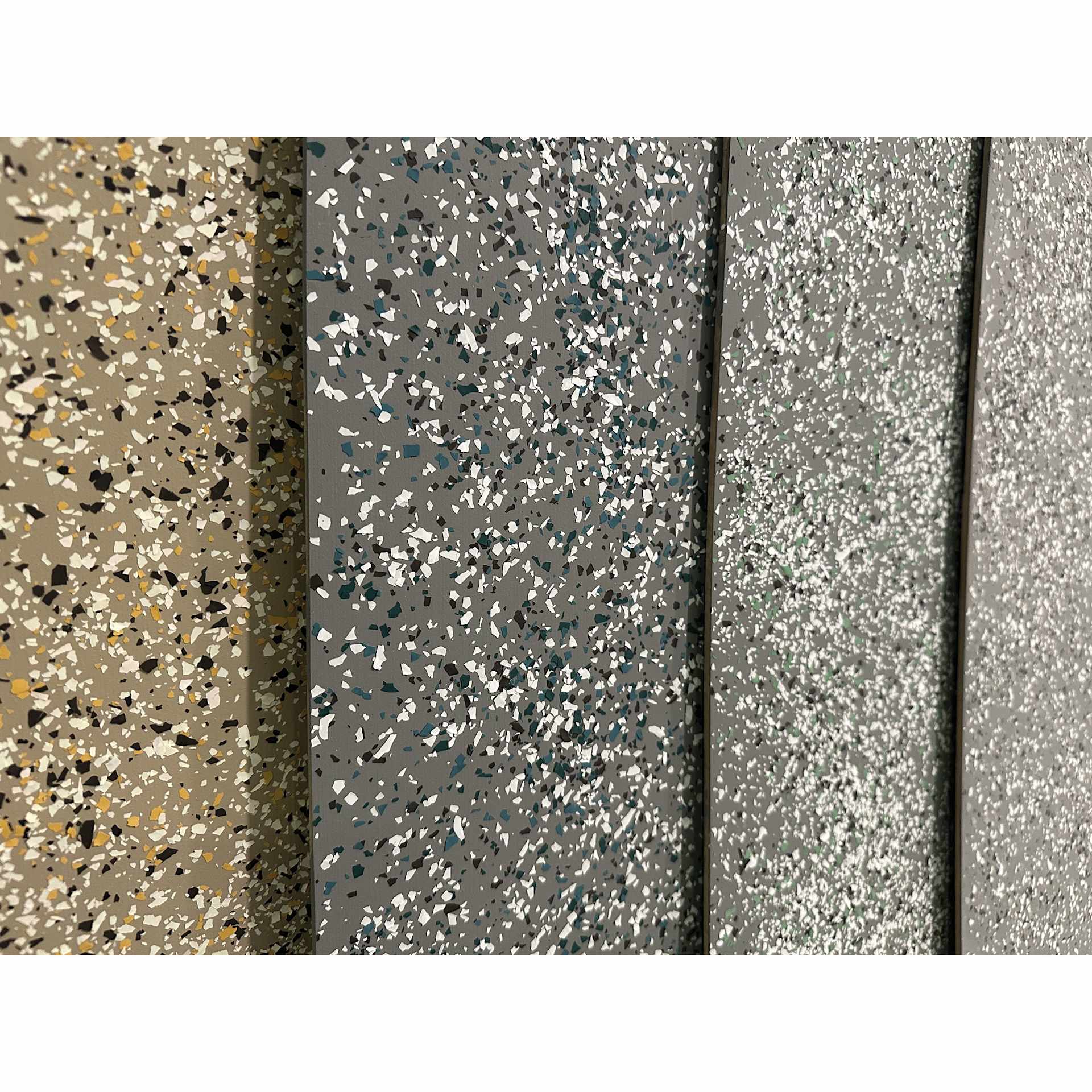 Fleur Terrazzo Effect Flakes on different colored backgrounds and broke in different coarseness. 