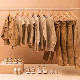 Rit All Purpose Liquid Dye - Tan, 8 oz, dyed clothes on a rack