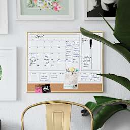 U Brands Gold Frame Dry Erase 2-in-1 Planner Board - Shown mounted on wall