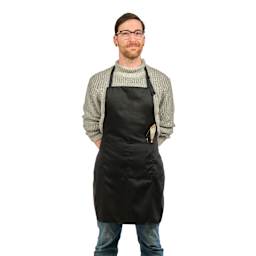 Front view of Blick Classic Black Apron on a person